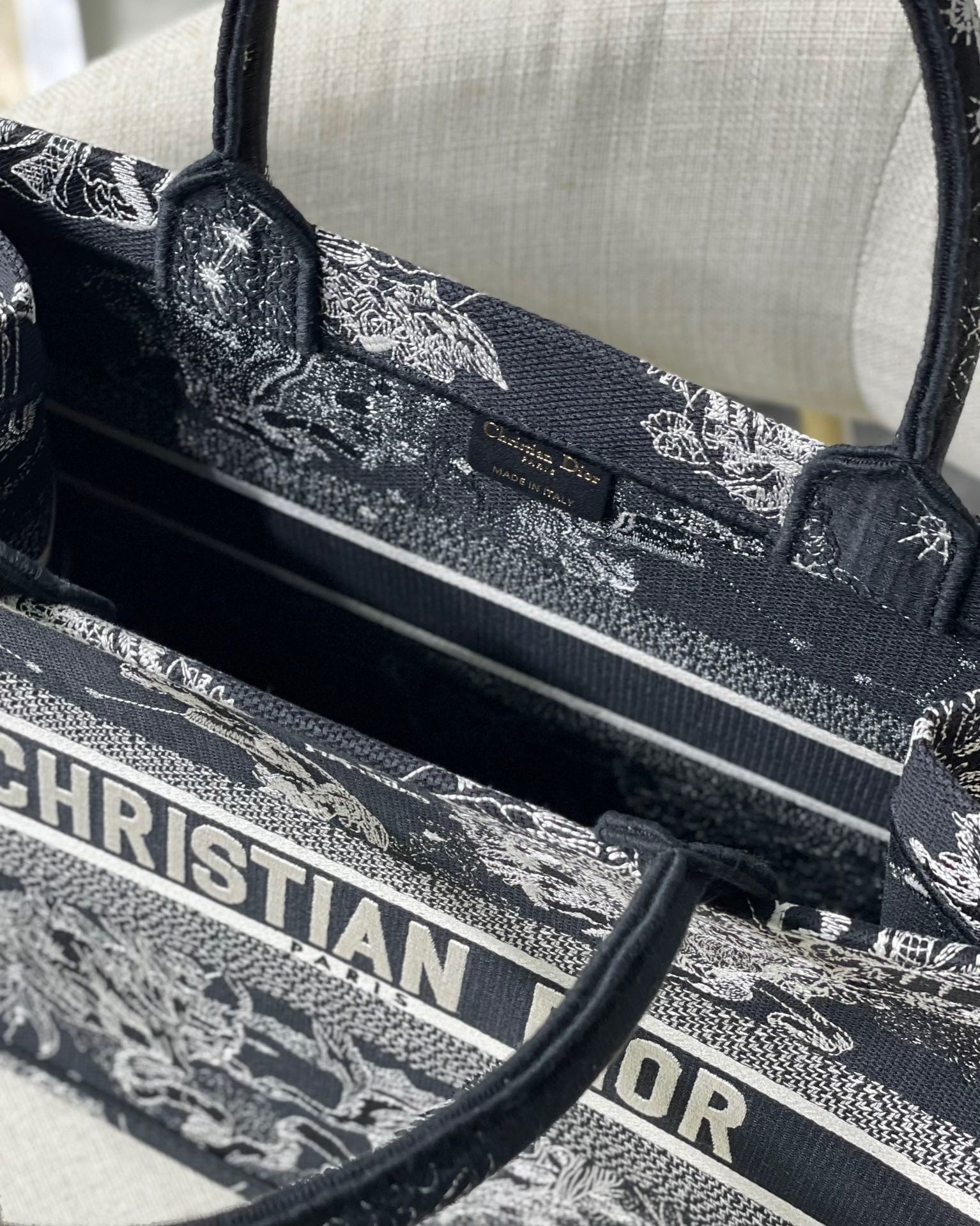 D*or medium book tote bag in black toile de jouy zodiac embroidery