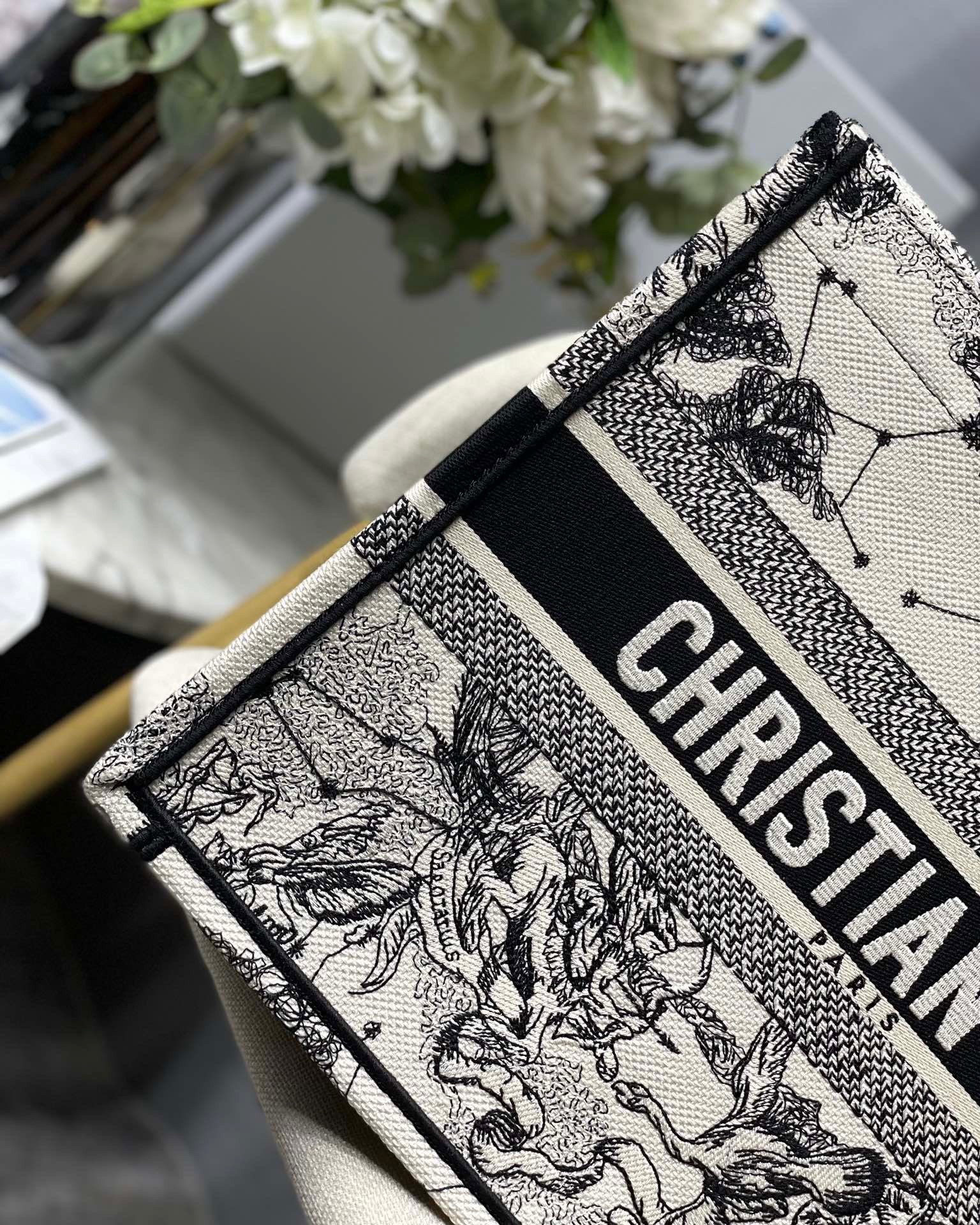 D*or medium book tote bag in white toile de jouy zodiac embroidery