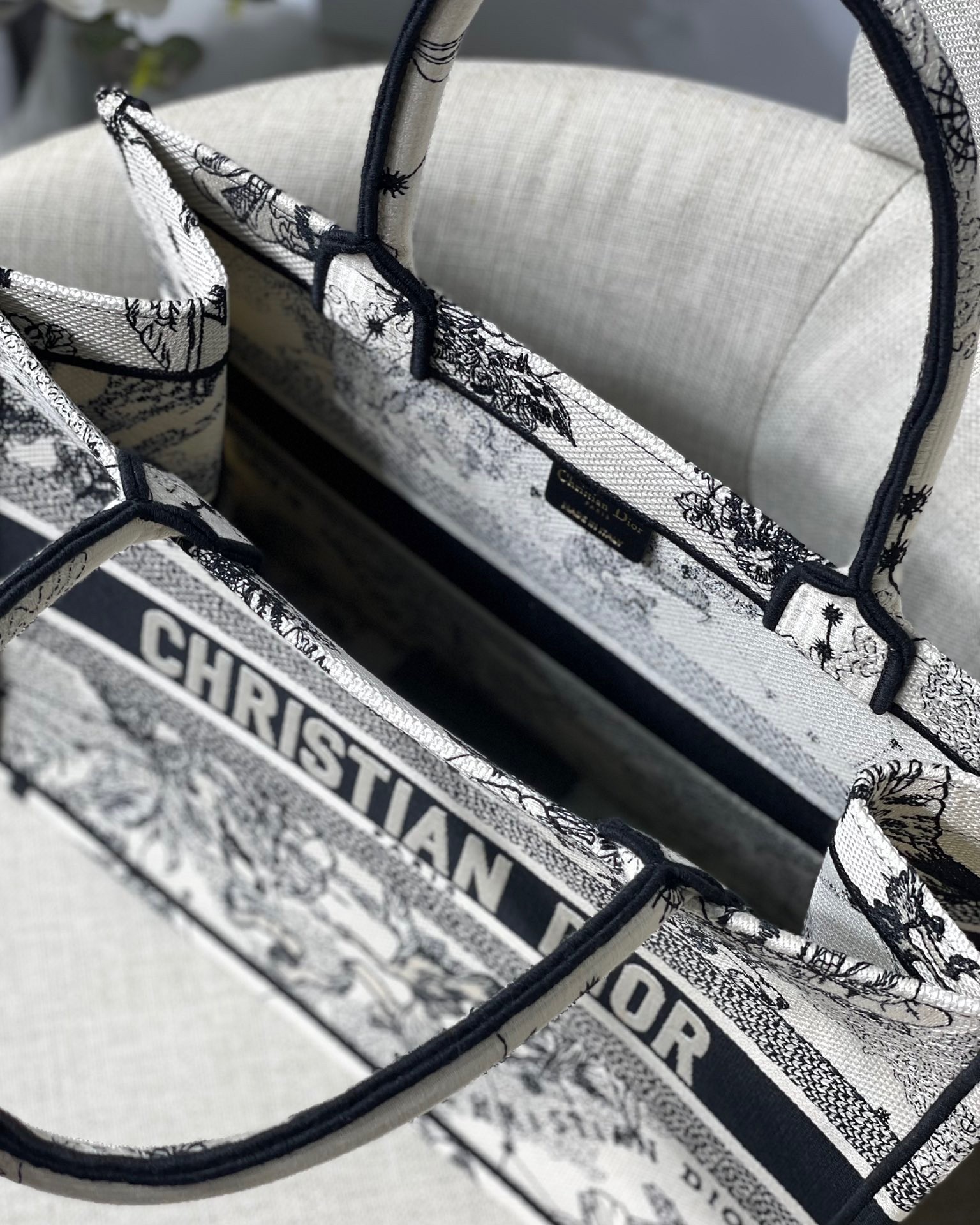 D*or medium book tote bag in white toile de jouy zodiac embroidery