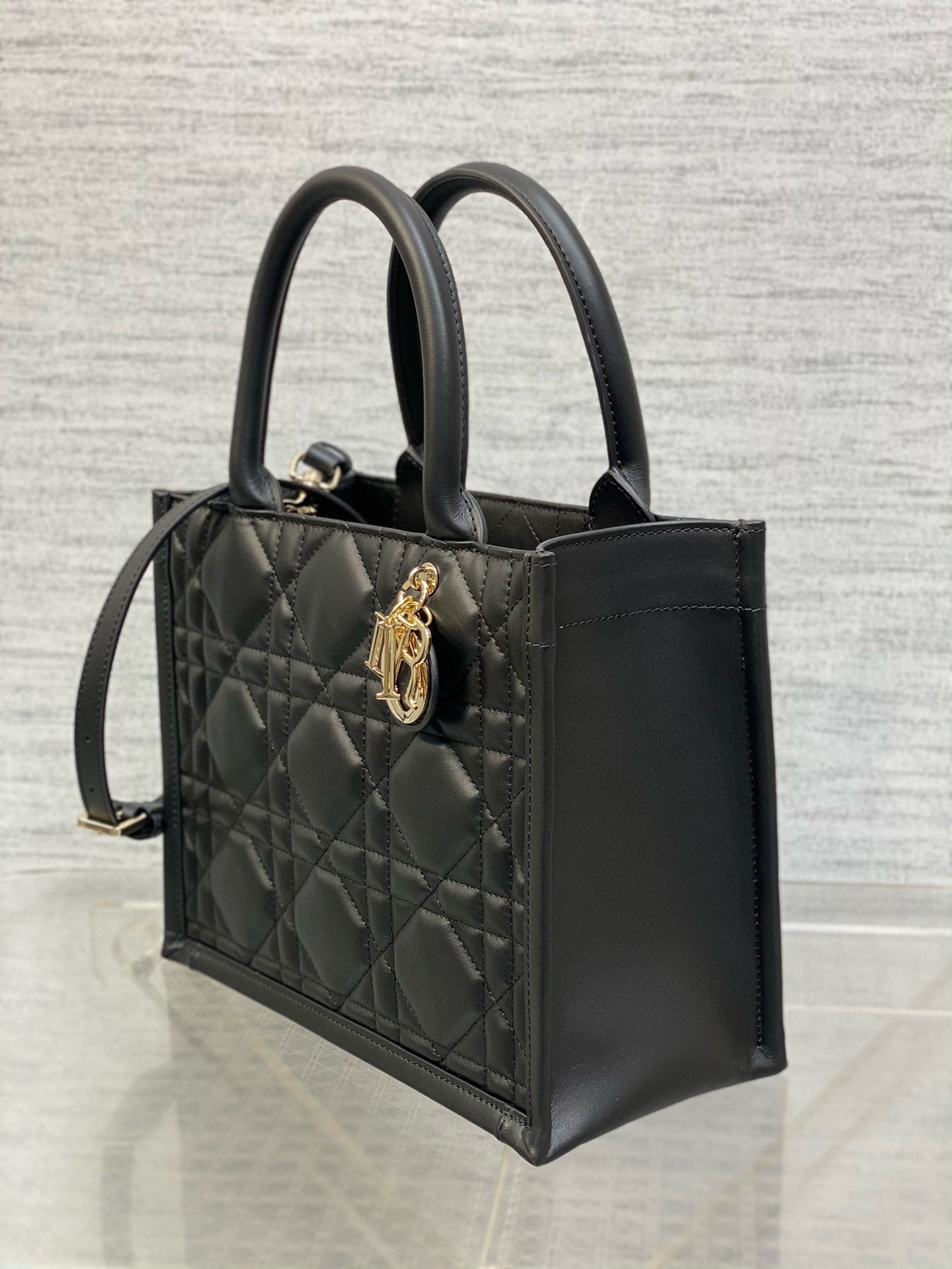 D*or small book tote bag with strap in black macrocannage calfskin