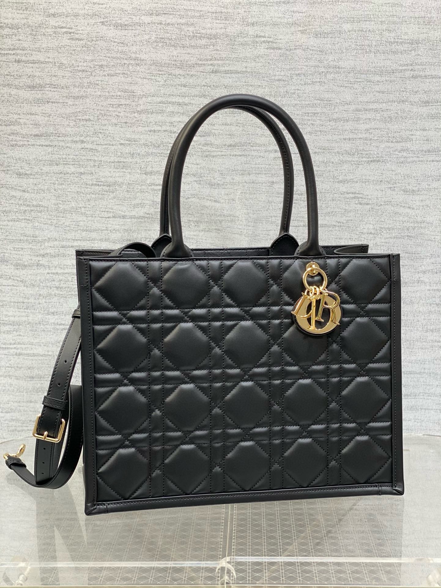 D*or medium book tote bag with strap in black macrocannage calfskin