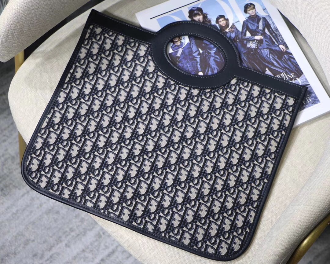 D*or fold over clutch in blue oblique canvas