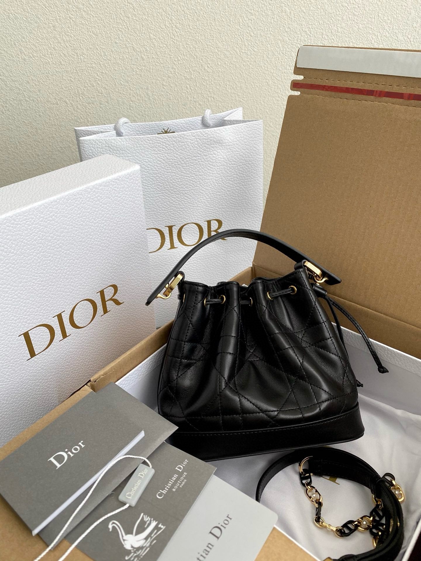 D*or small jolie bucket bag in black macrocannage lambskin