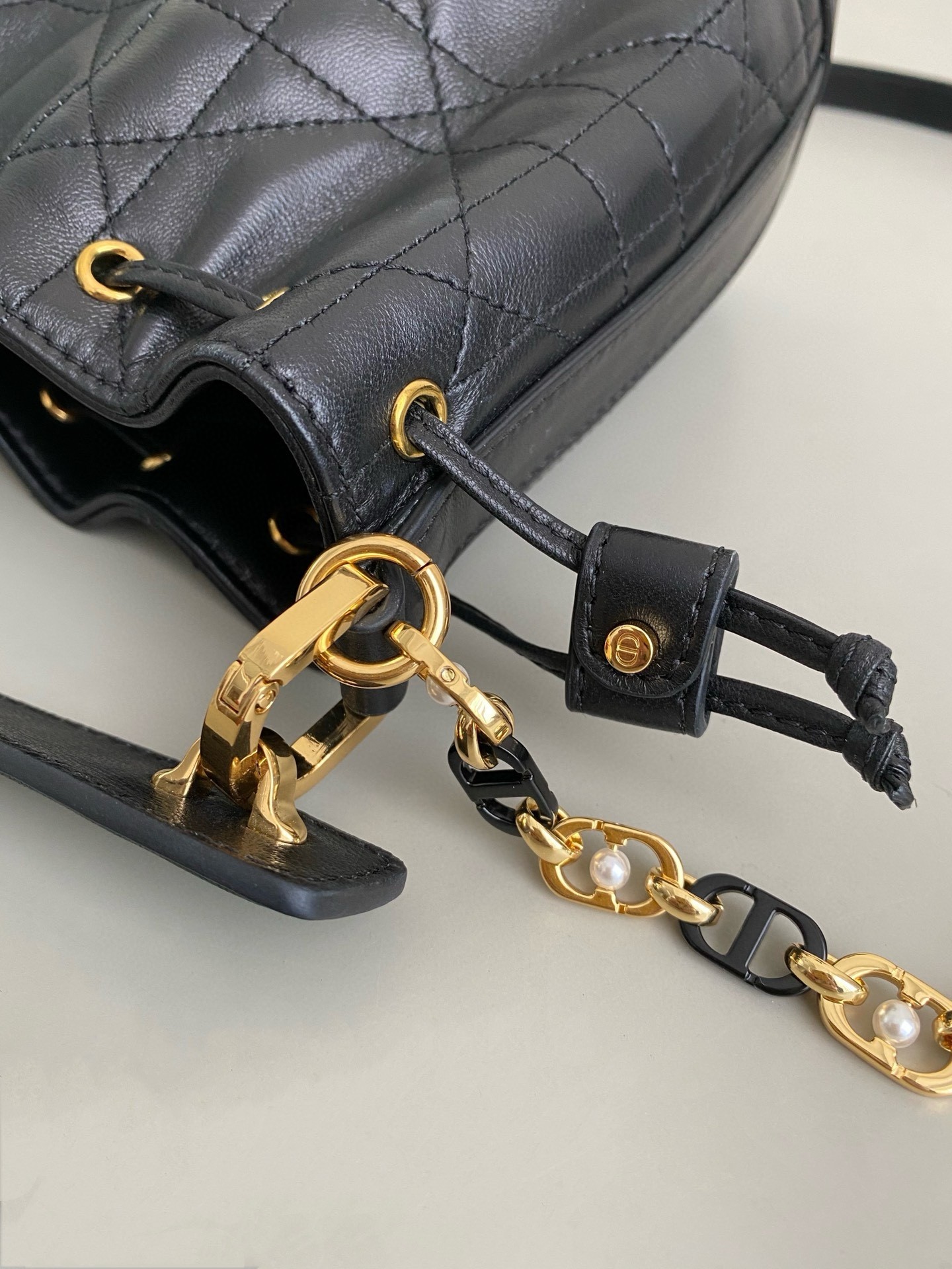 D*or small jolie bucket bag in black macrocannage lambskin