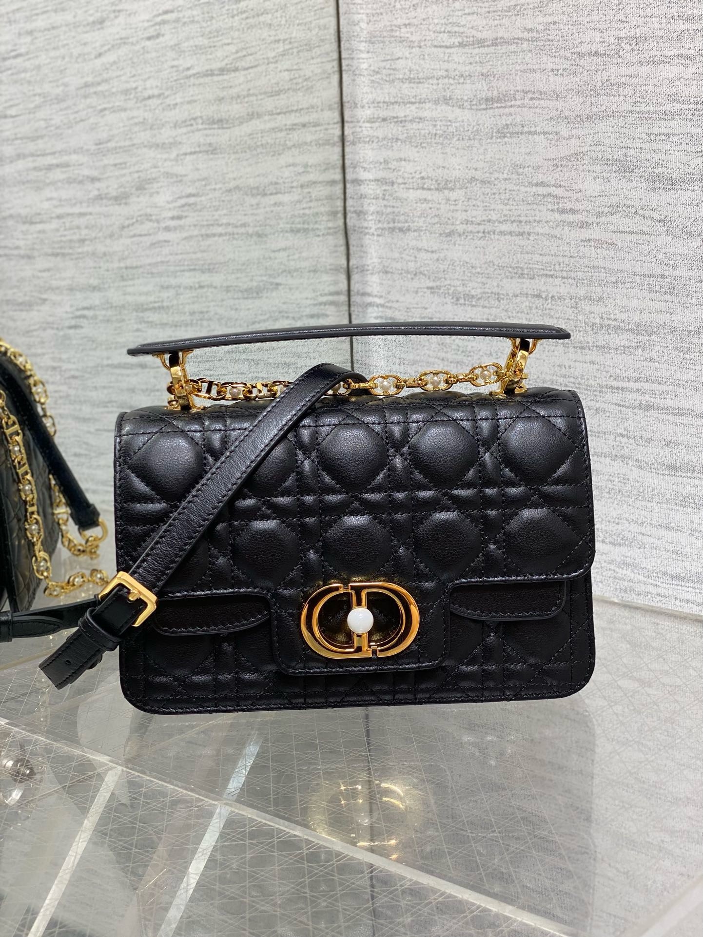 D*or small jolie top handle bag in black cannage calfskin