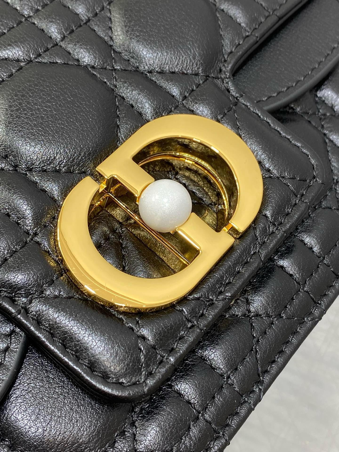 D*or small jolie top handle bag in black cannage calfskin