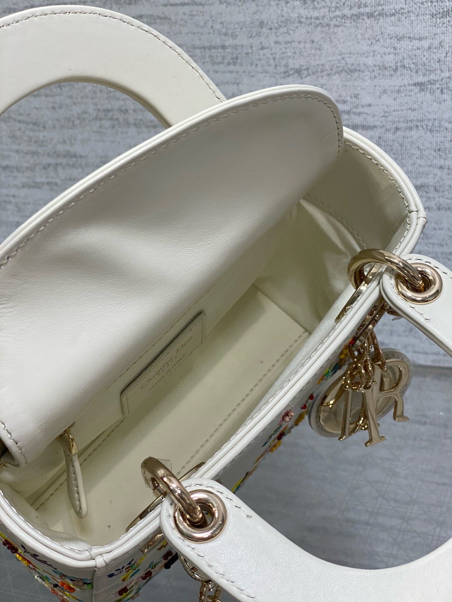 D*or lady D*or mini bag in white calfskin with multicolor small flowers
