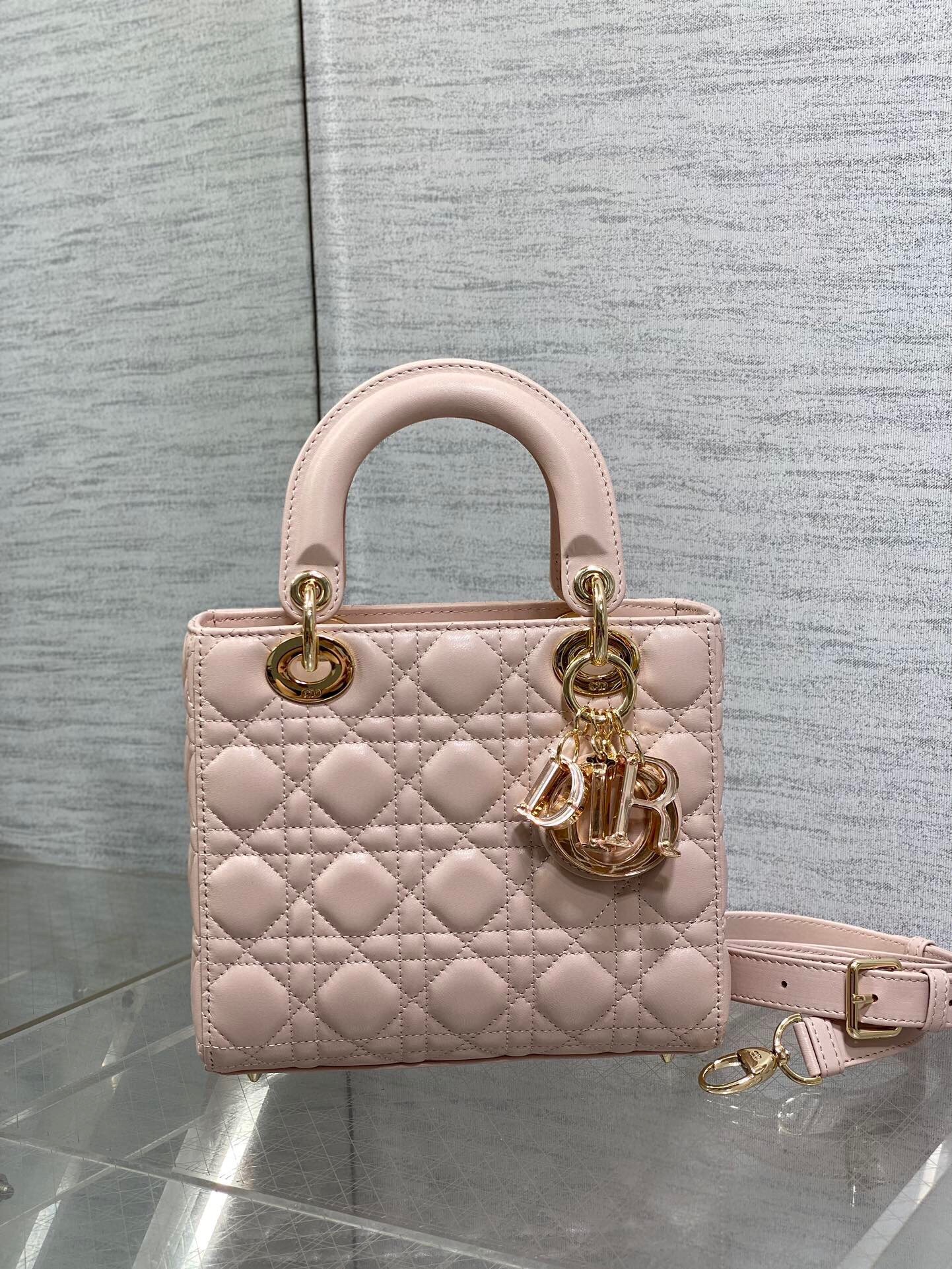 D*or small lady D*or bag in pink lambskin with resin charms