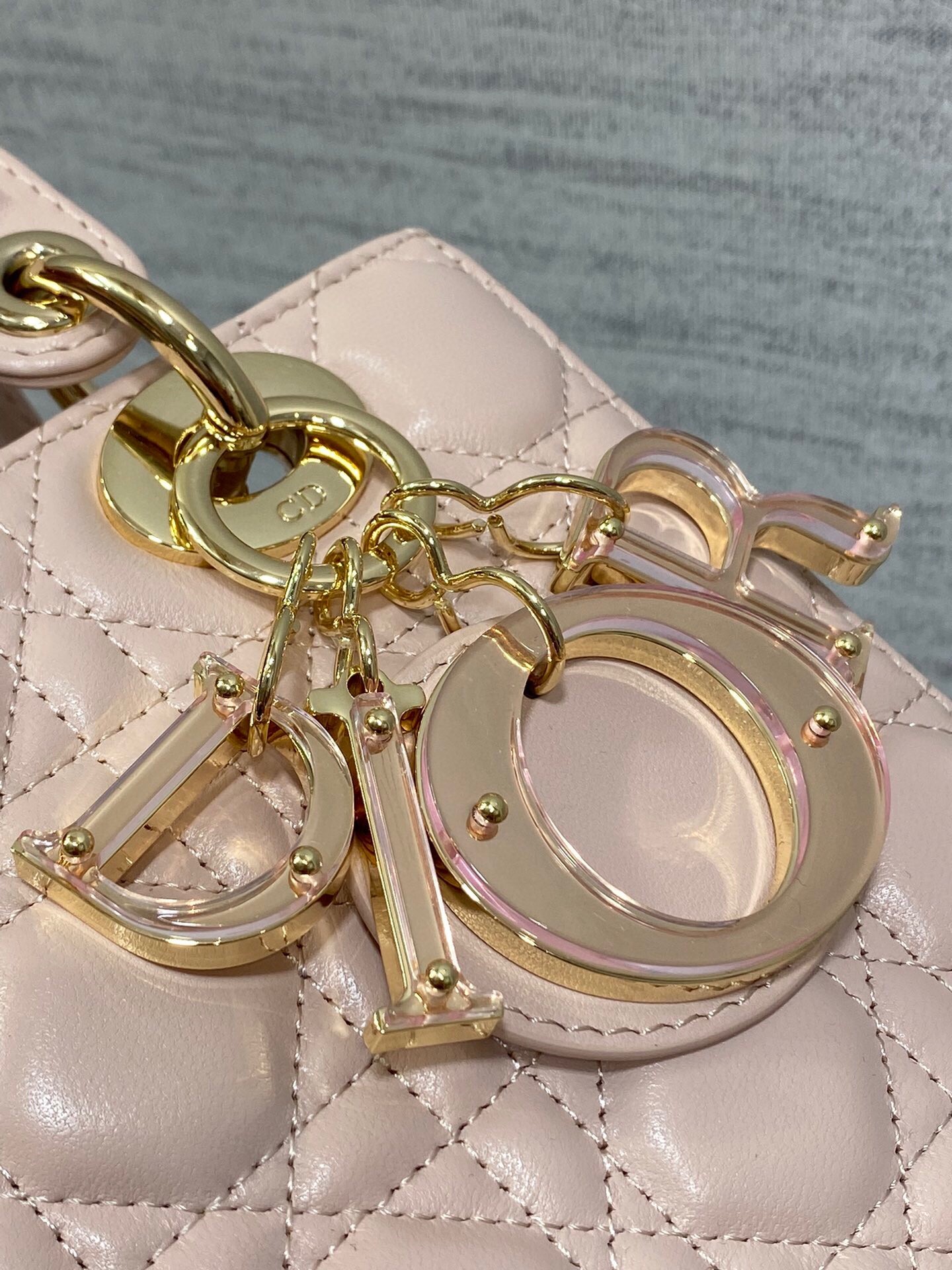 D*or small lady D*or bag in pink lambskin with resin charms