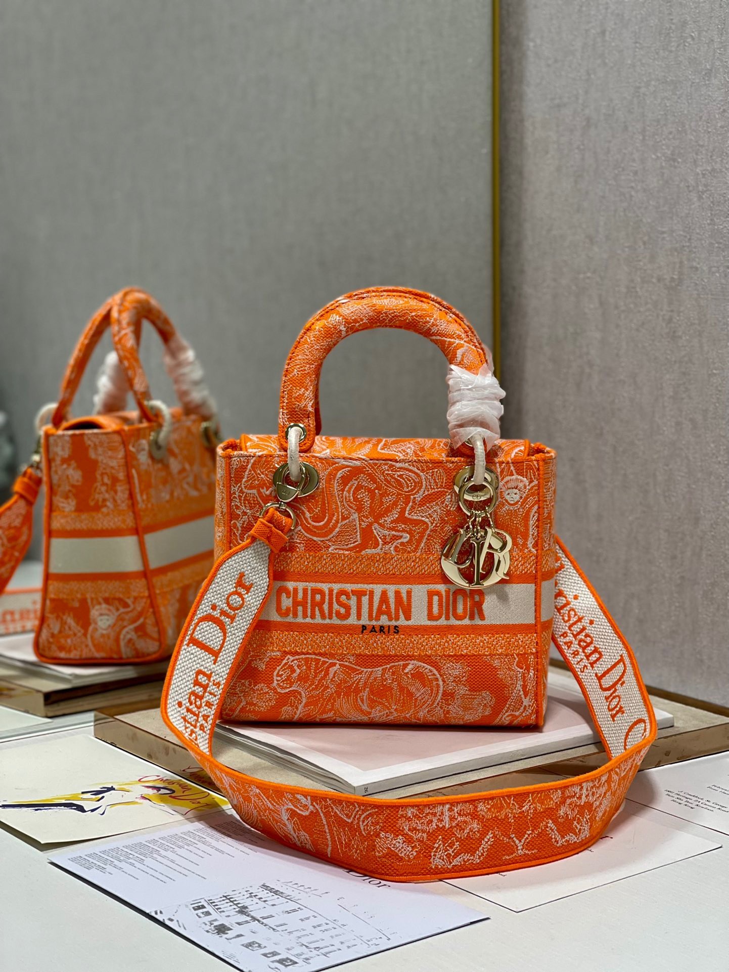 D*or medium lady d-lite bag in fluorescent orange toile de jouy reverse embroidery