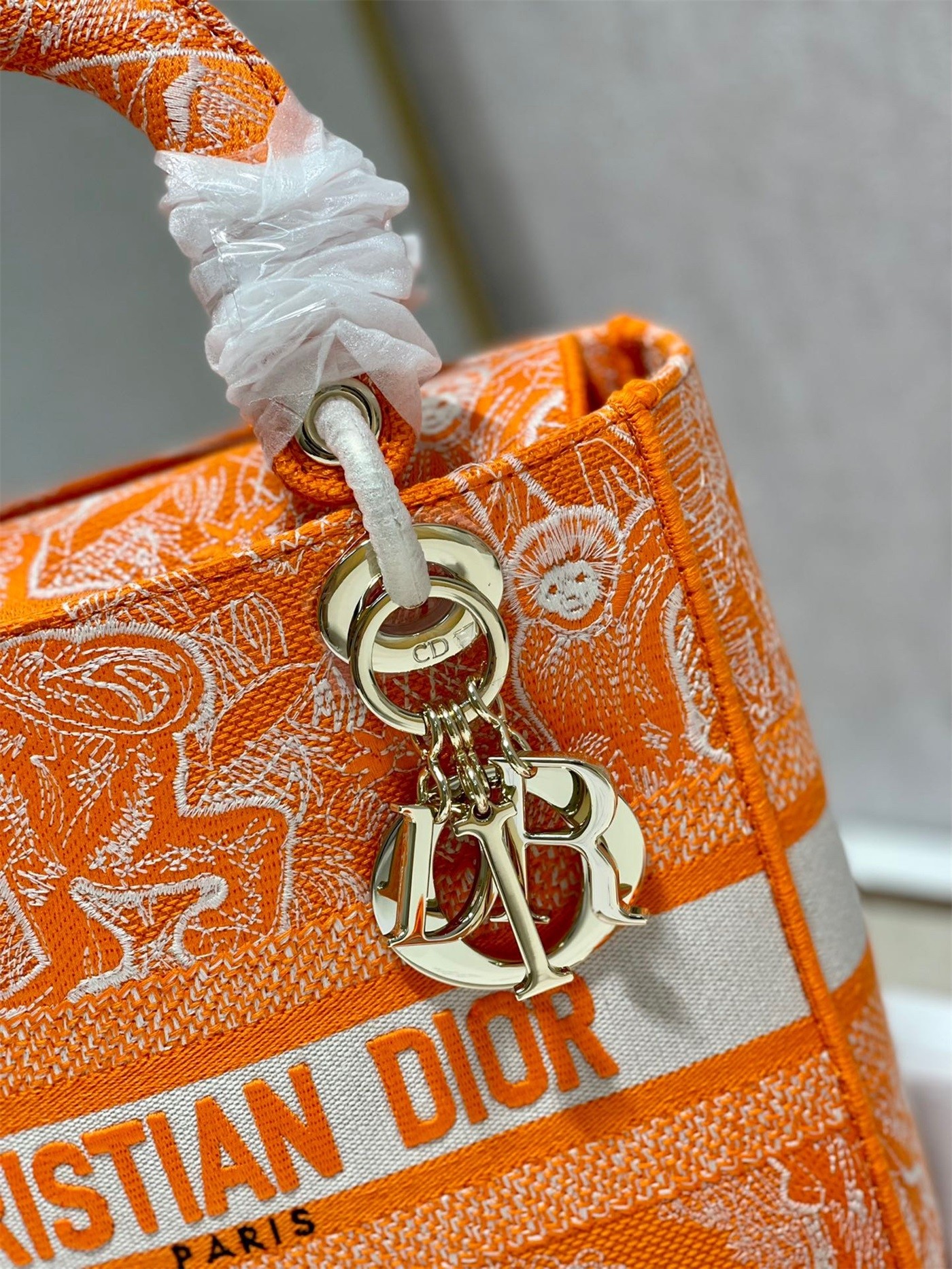 D*or medium lady d-lite bag in fluorescent orange toile de jouy reverse embroidery