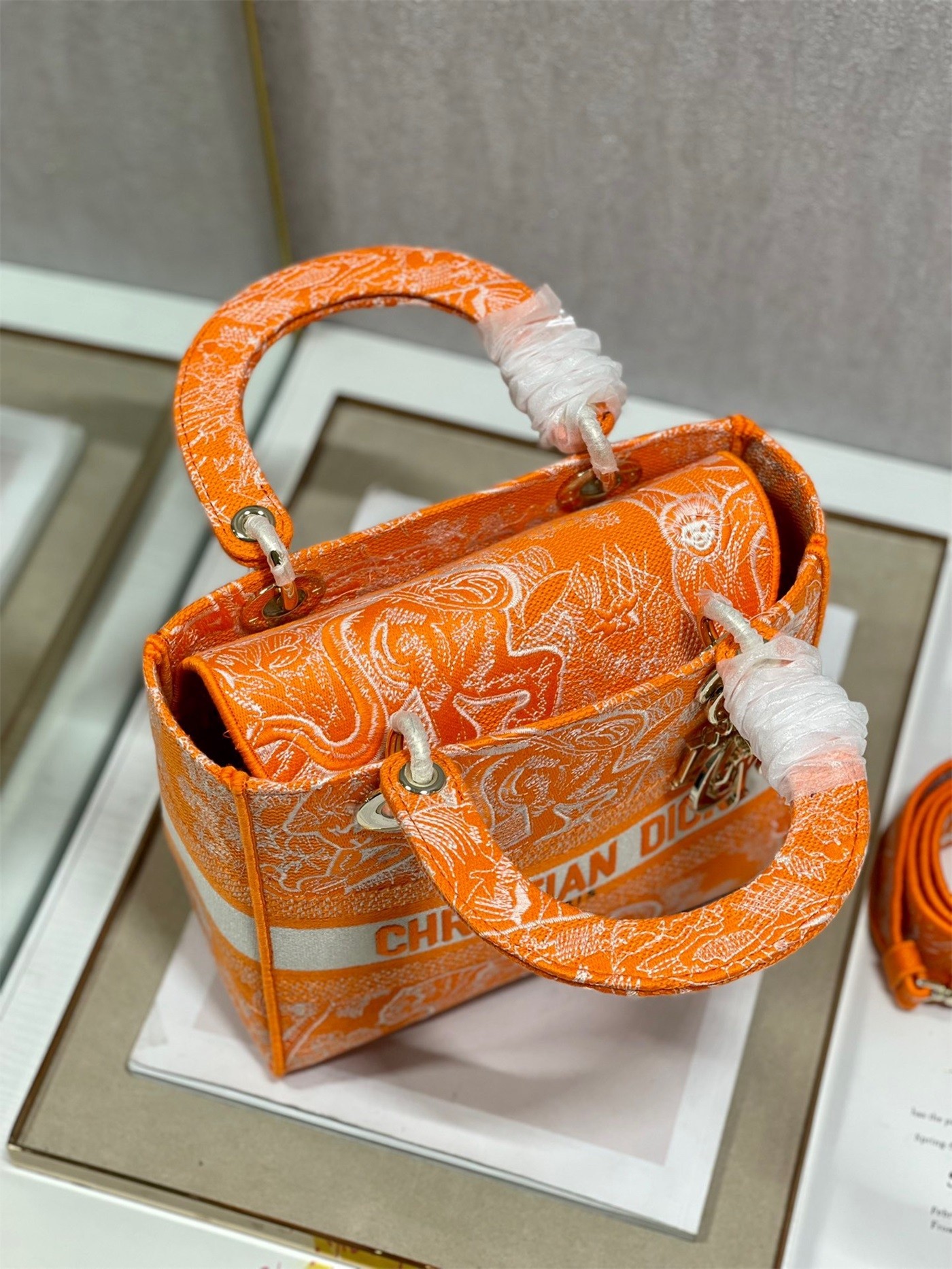 D*or medium lady d-lite bag in fluorescent orange toile de jouy reverse embroidery