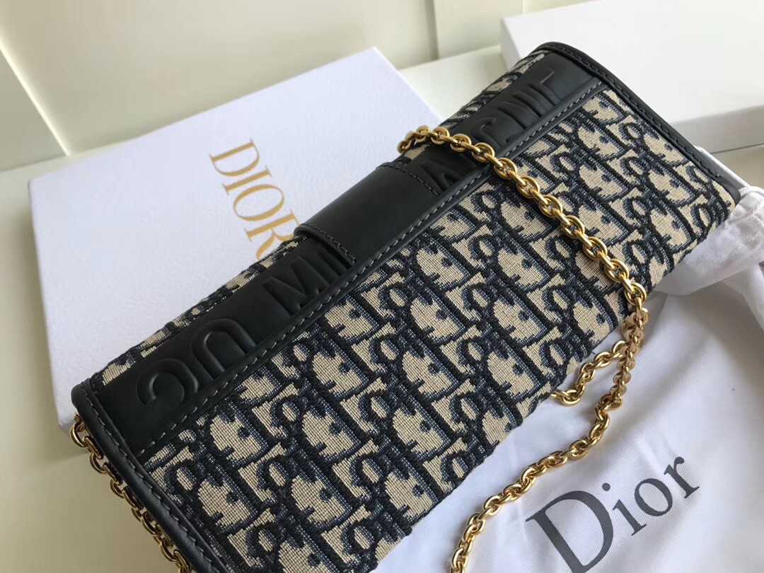 D*or 30 montaigne clutch bag in blue oblique canvas