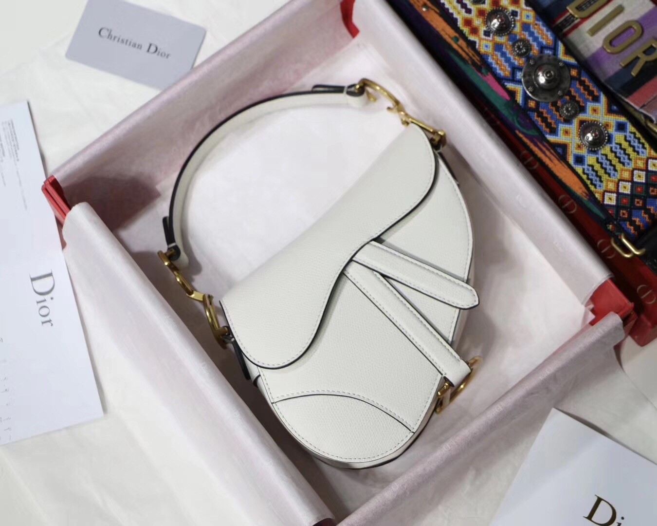 D*or mini saddle bag in white grained calfskin