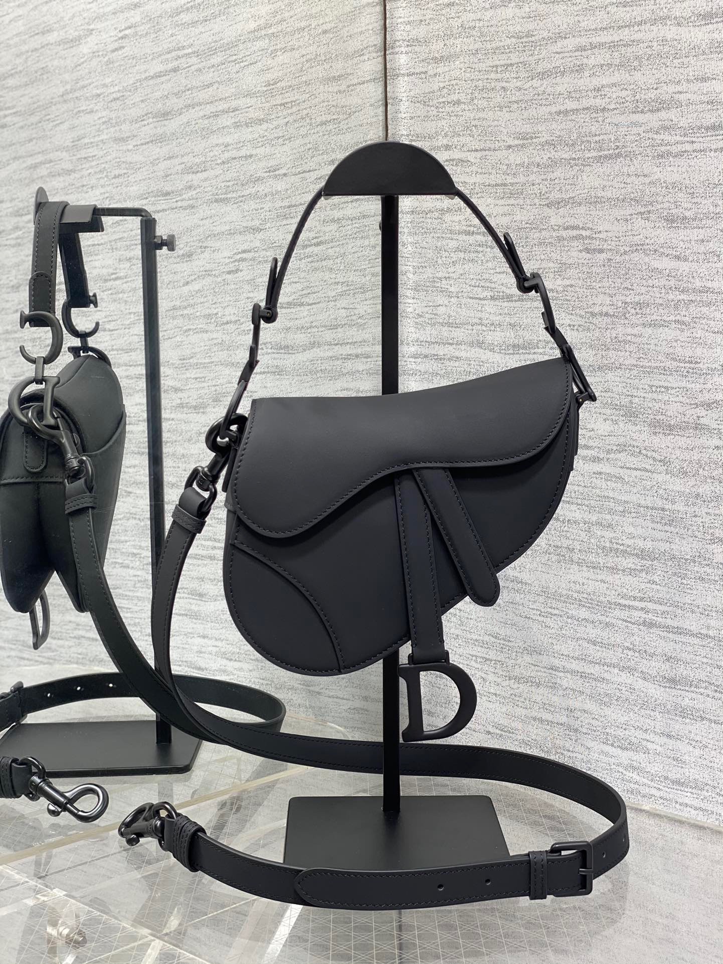 D*or mini saddle bag with strap in black ultramatte calfskin