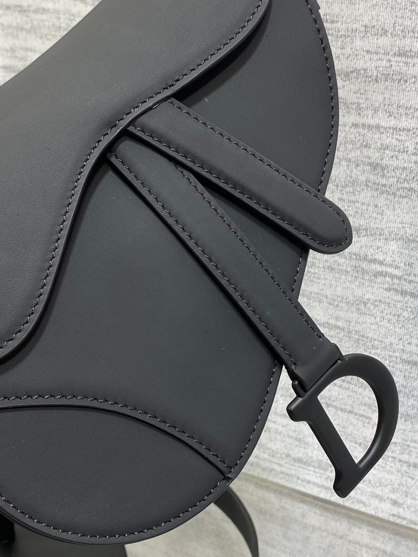 D*or mini saddle bag with strap in black ultramatte calfskin