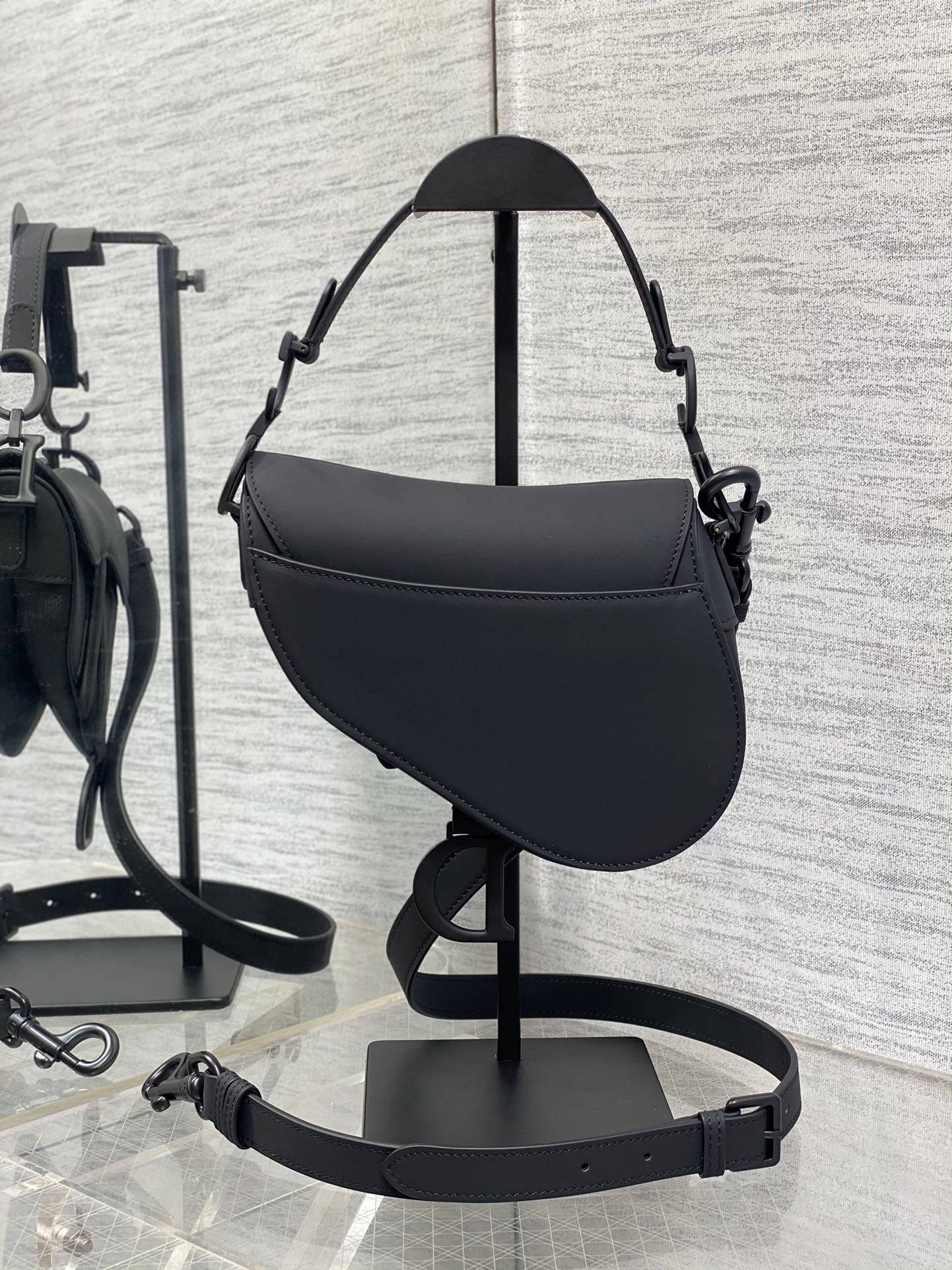 D*or mini saddle bag with strap in black ultramatte calfskin