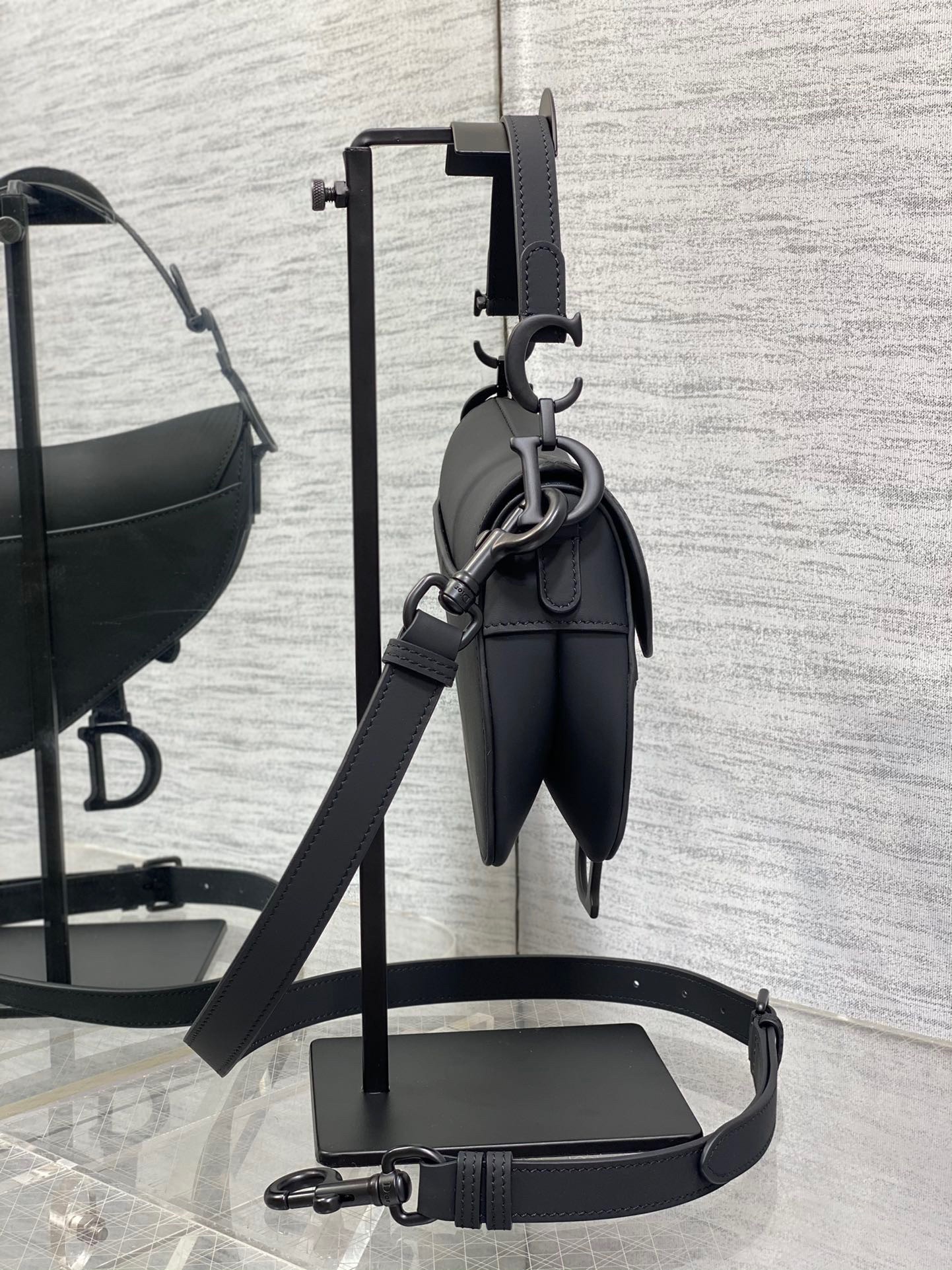 D*or mini saddle bag with strap in black ultramatte calfskin