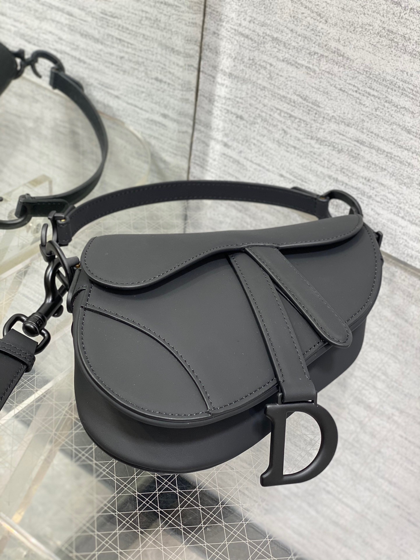 D*or mini saddle bag with strap in black ultramatte calfskin