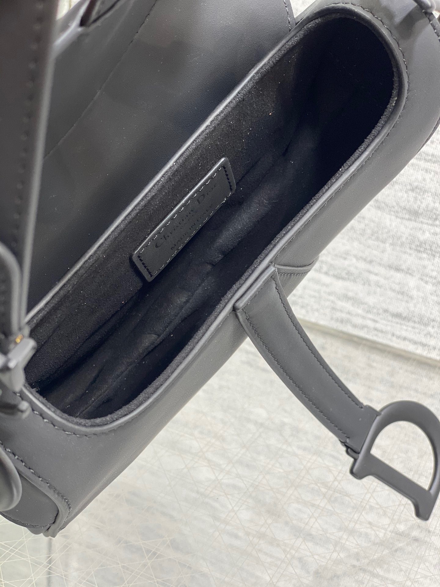 D*or mini saddle bag with strap in black ultramatte calfskin