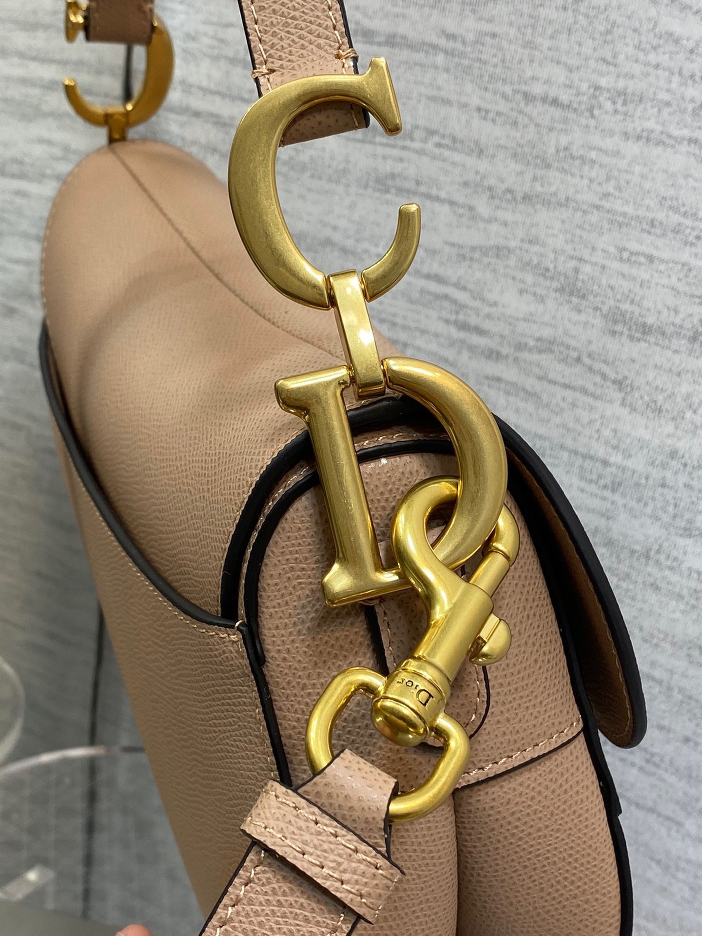 D*or saddle bag with strap in blush grained calfskin