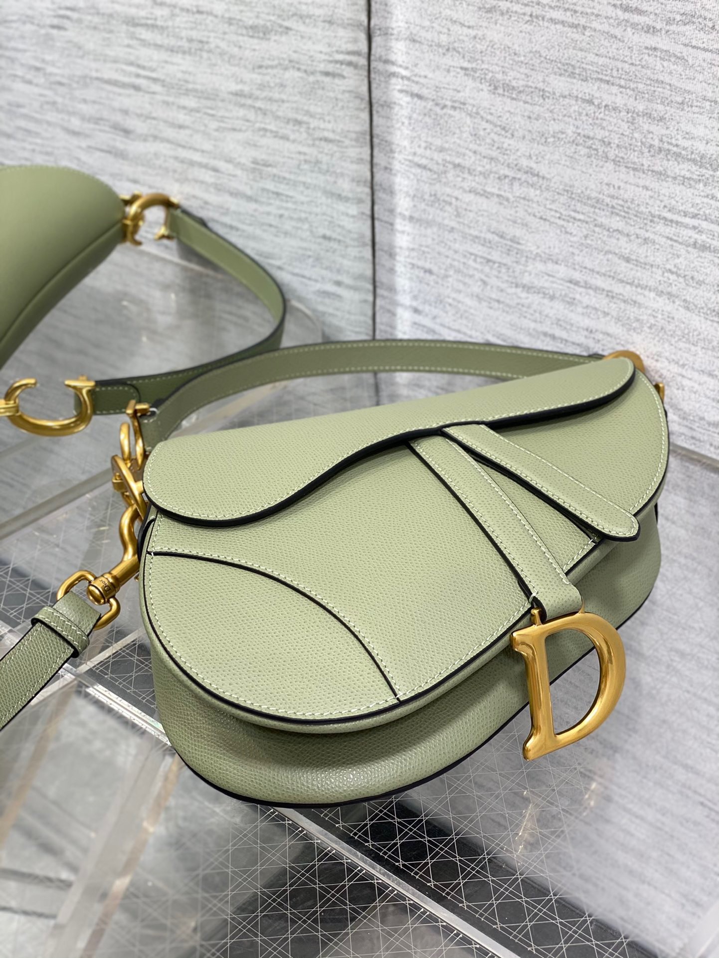 D*or saddle bag with strap in ethereal green grained calfskin