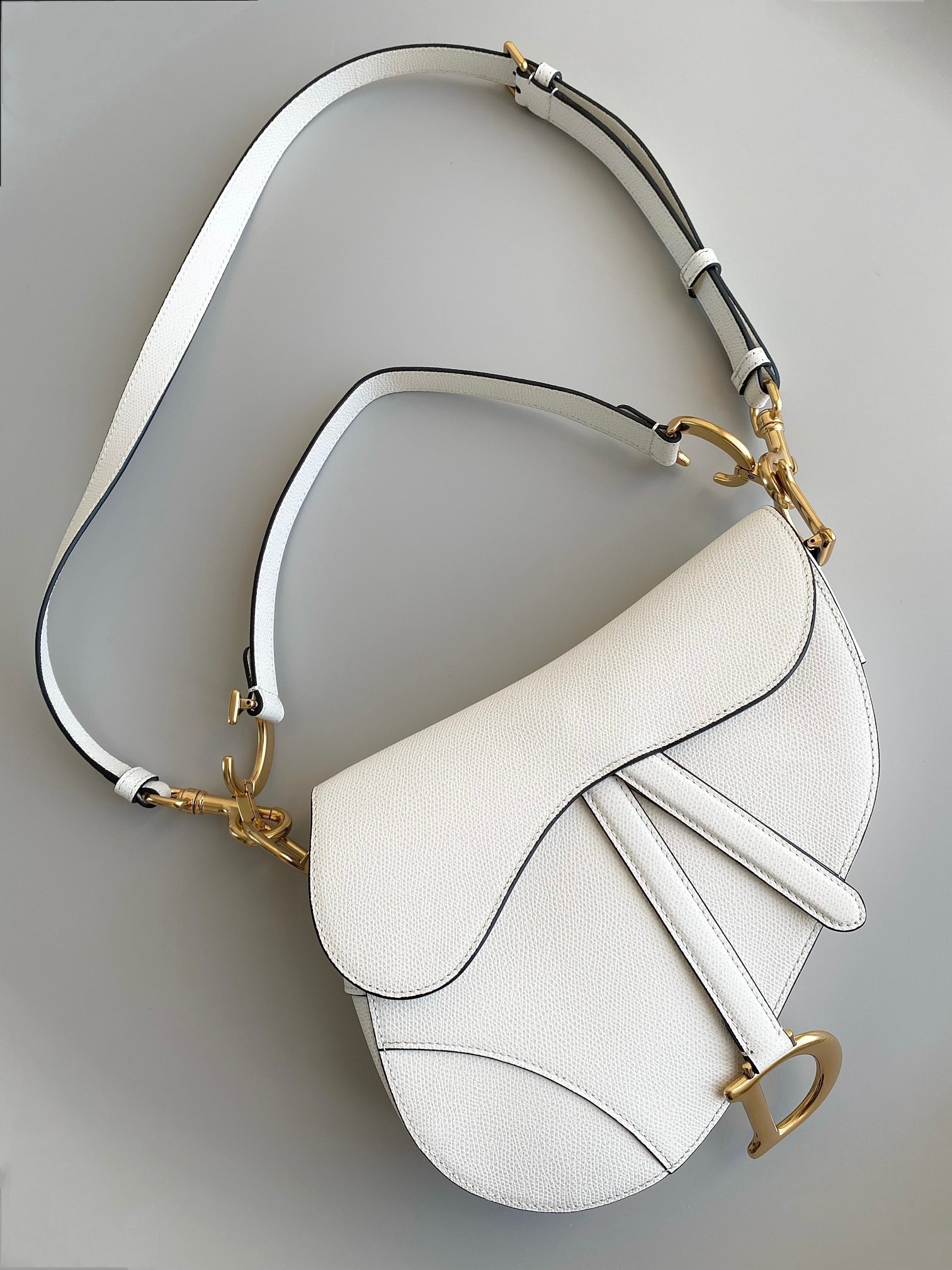 D*or saddle bag with strap in white grained calfskin