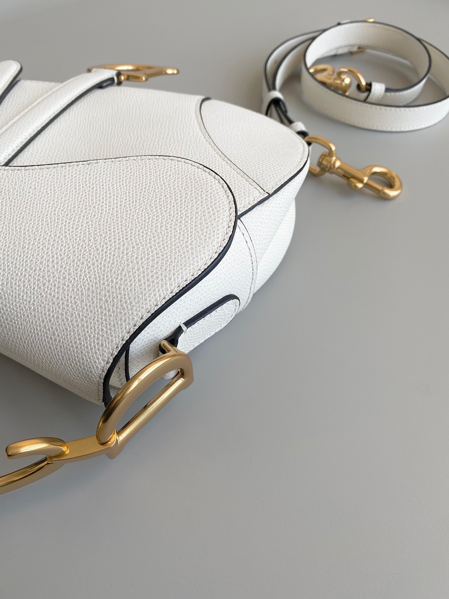 D*or saddle bag with strap in white grained calfskin
