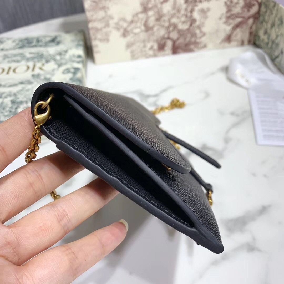 D*or saddle chain wallet in black grained leather