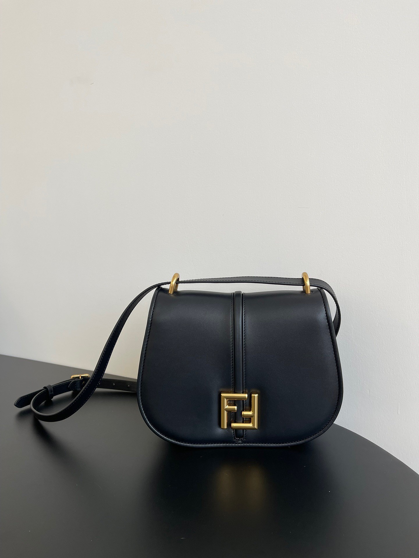 F**di c’mon medium bag in black calfskin