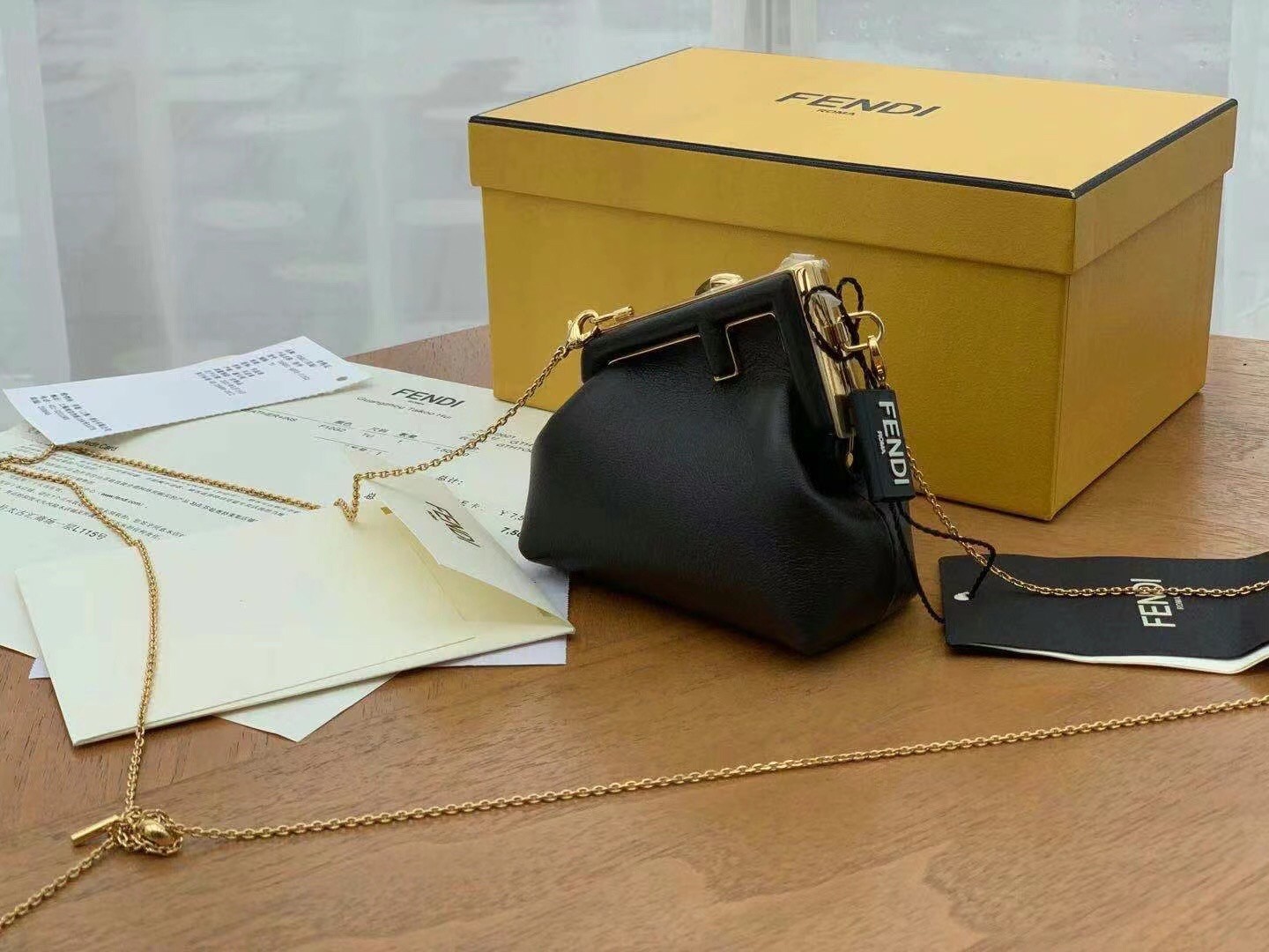 F**di first nano charm bag in black nappa leather