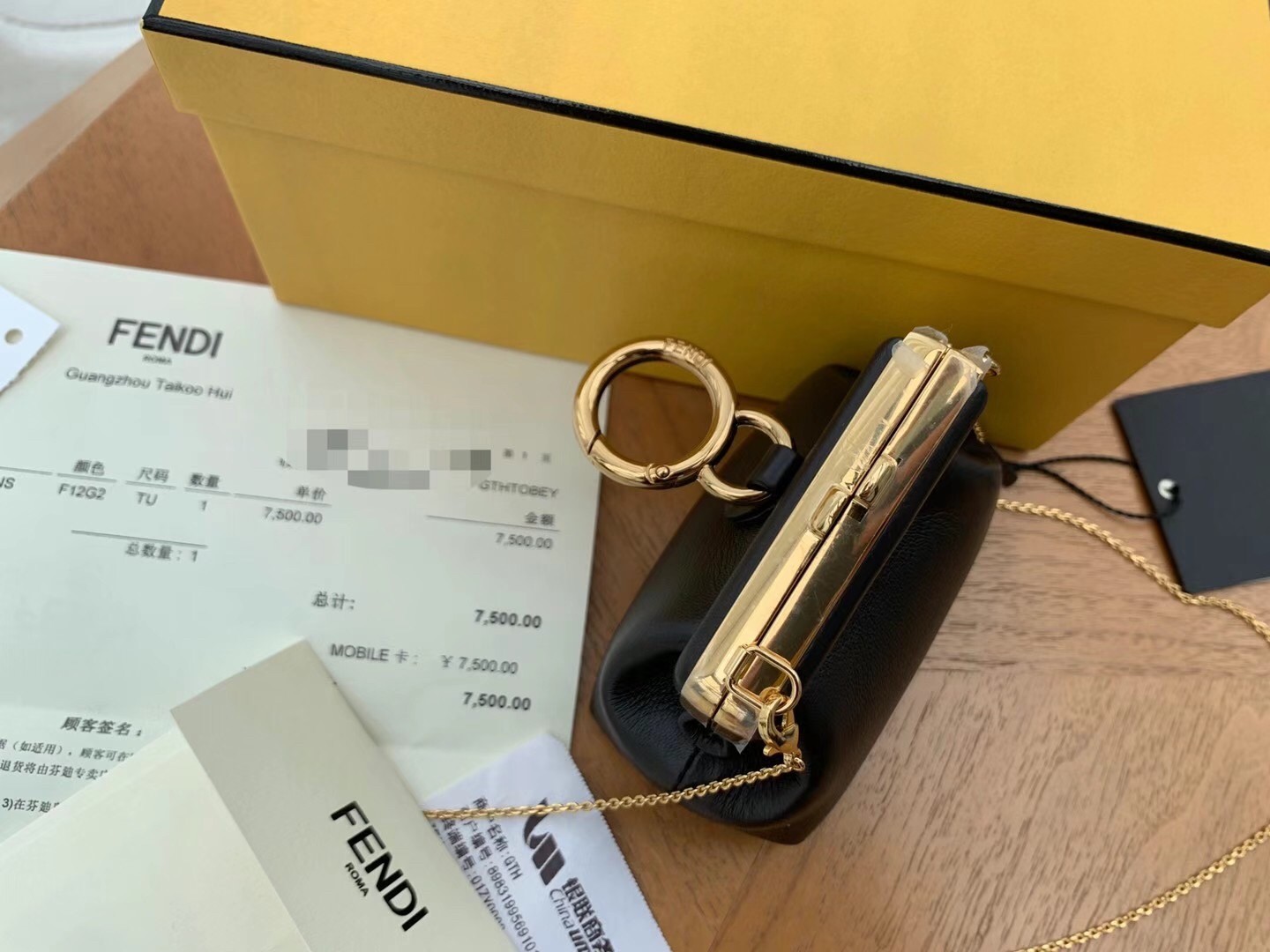 F**di first nano charm bag in black nappa leather
