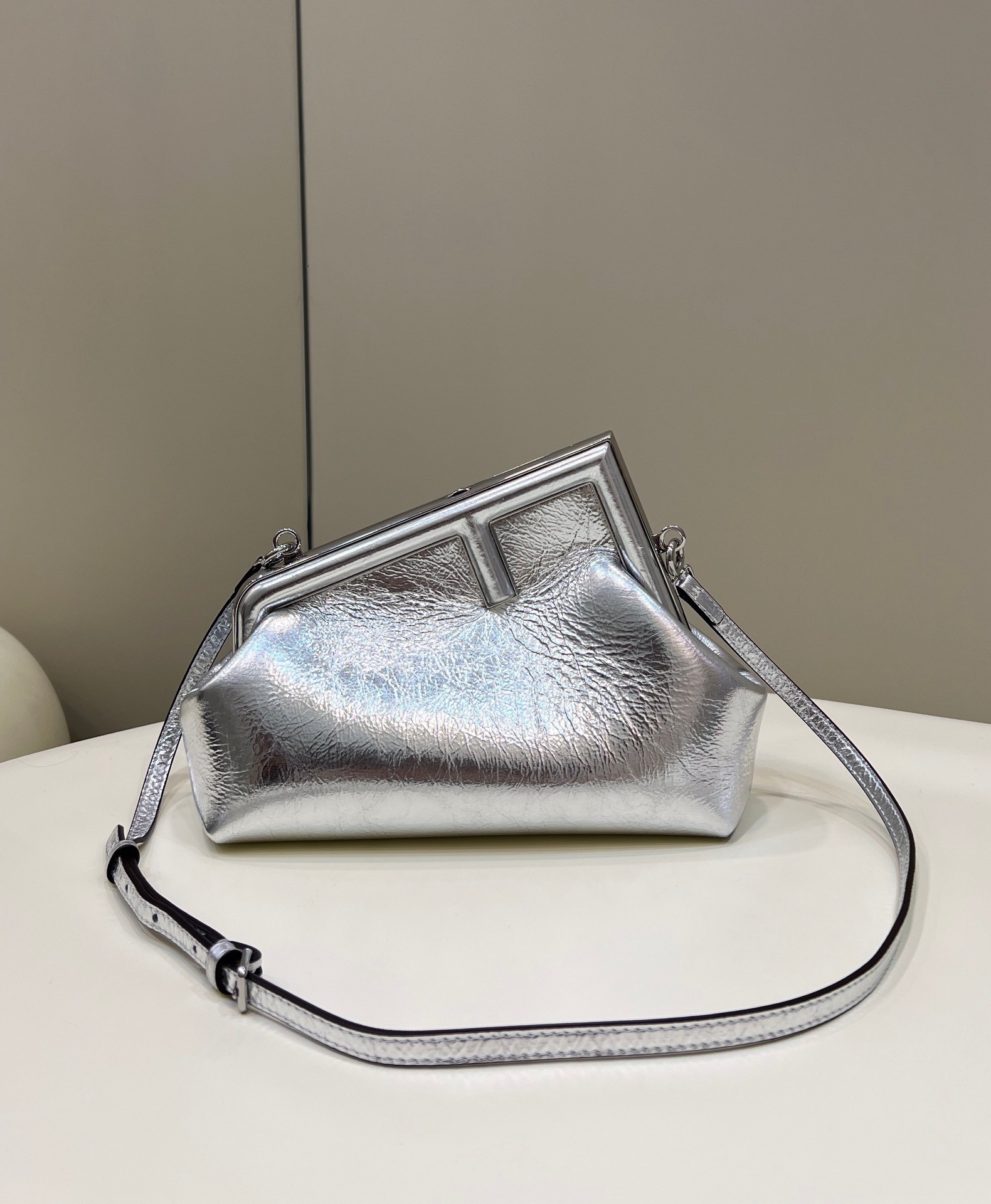 F**di first small bag in silver laminated leather