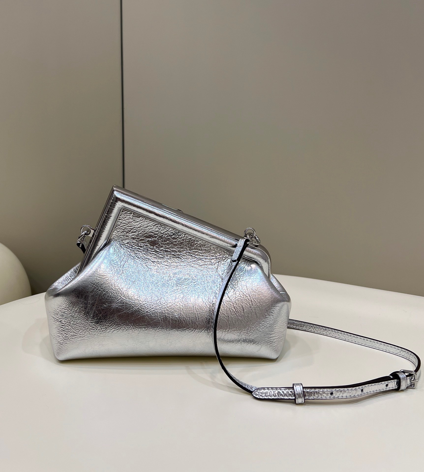 F**di first small bag in silver laminated leather