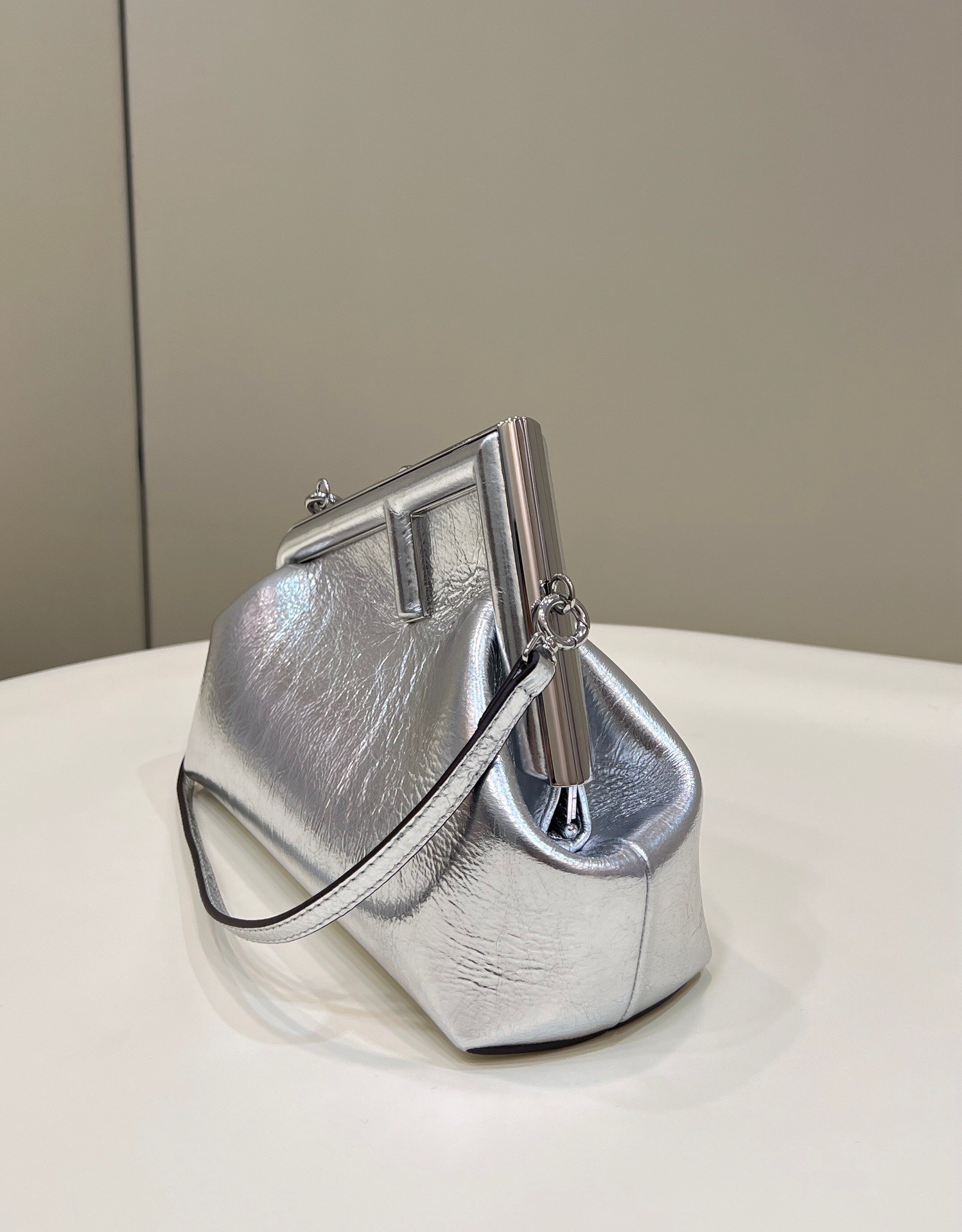 F**di first small bag in silver laminated leather