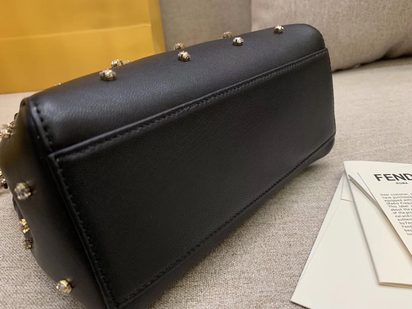 F**di peekaboo xs bag with star studs in black nappa leather