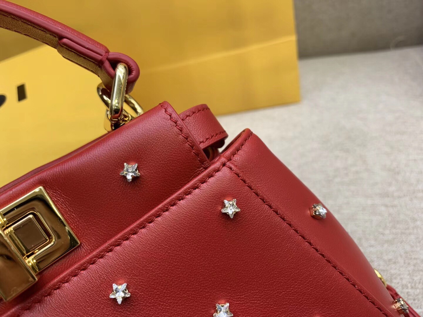 F**di peekaboo xs bag with star studs in red nappa leather