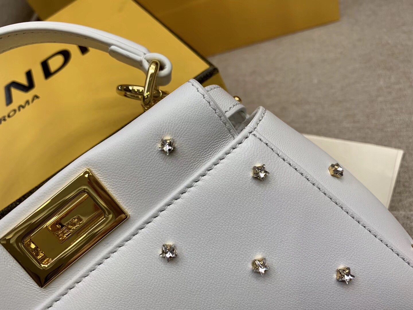 F**di peekaboo xs bag with star studs in white nappa leather