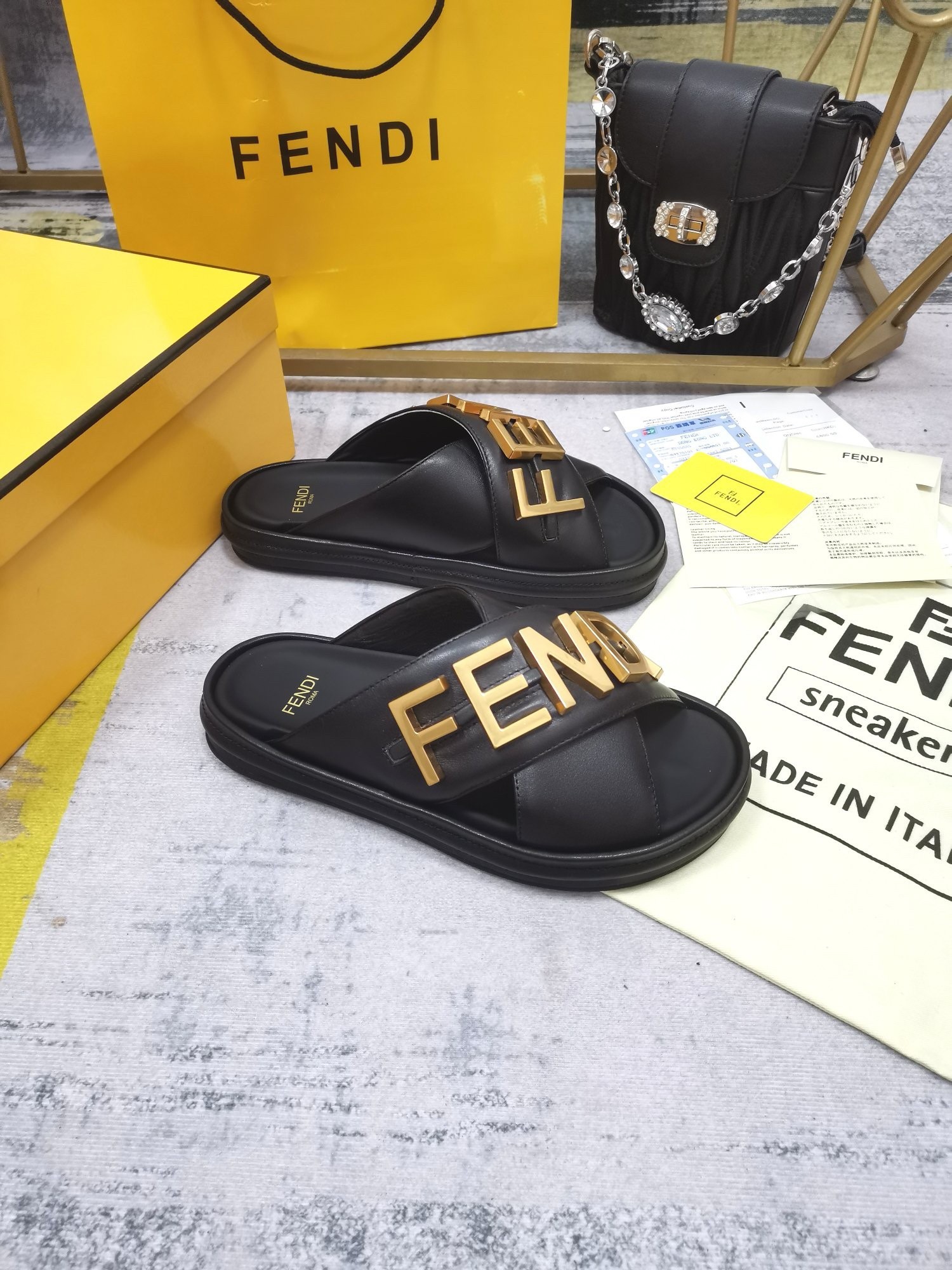 F**di F**digraphy slides in black calfskin