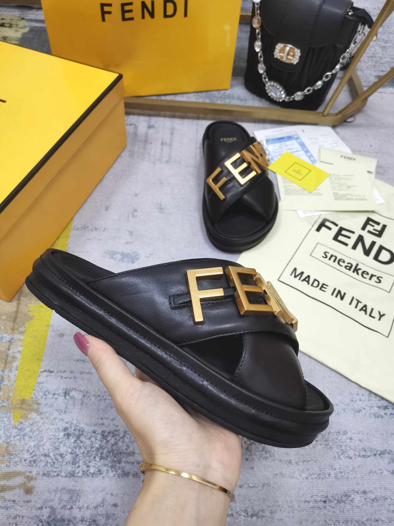 F**di F**digraphy slides in black calfskin