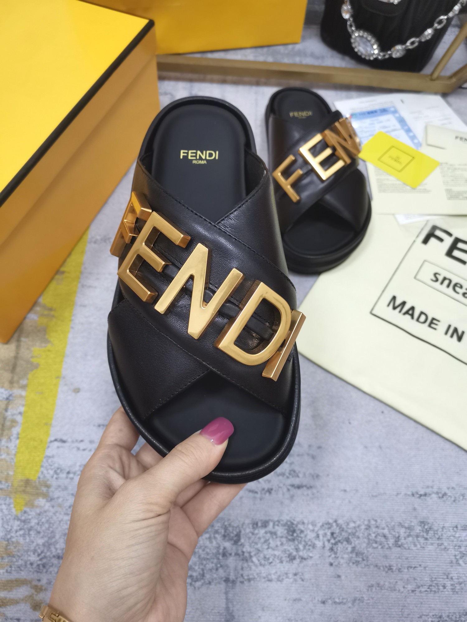 F**di F**digraphy slides in black calfskin