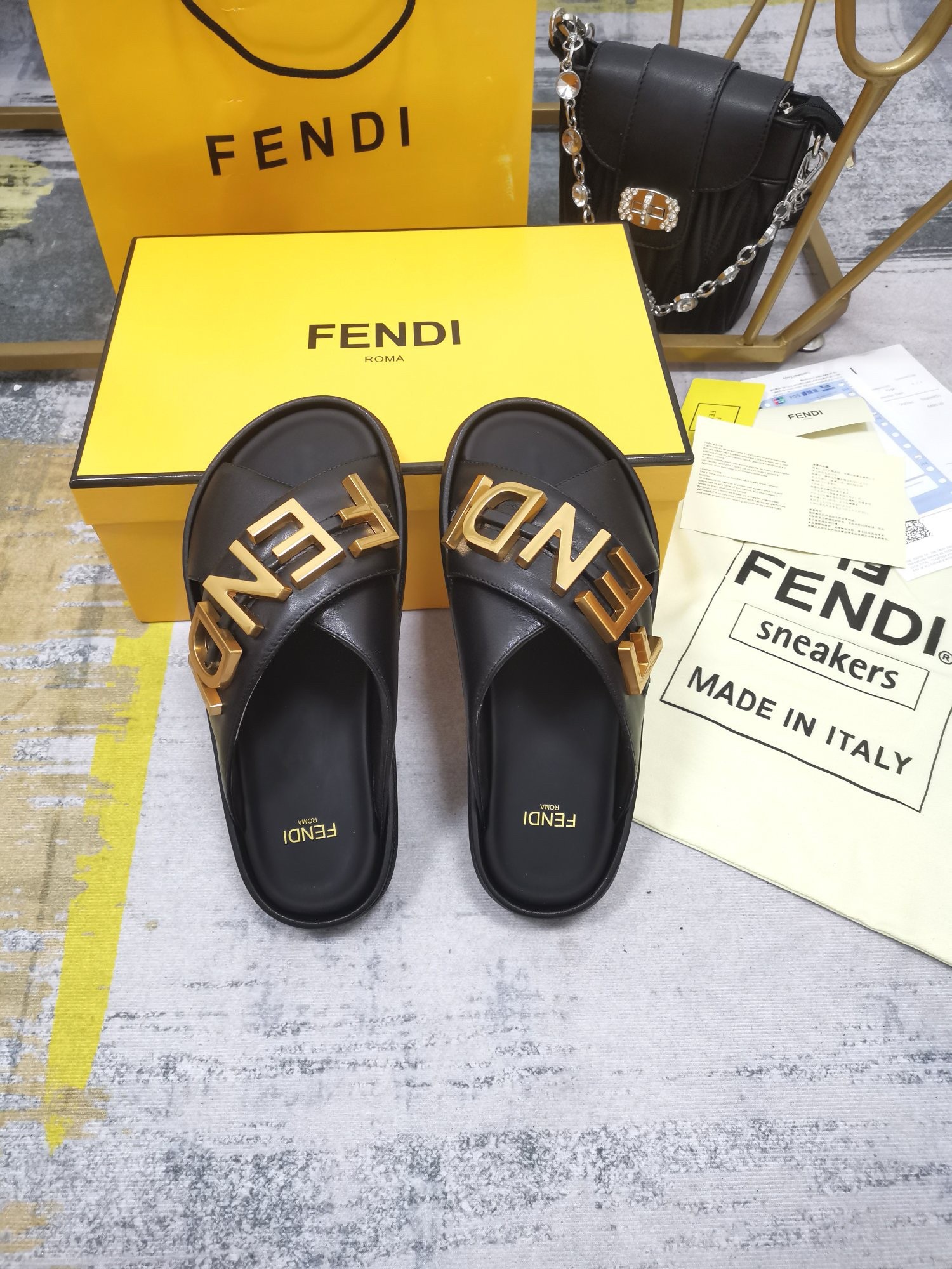 F**di F**digraphy slides in black calfskin