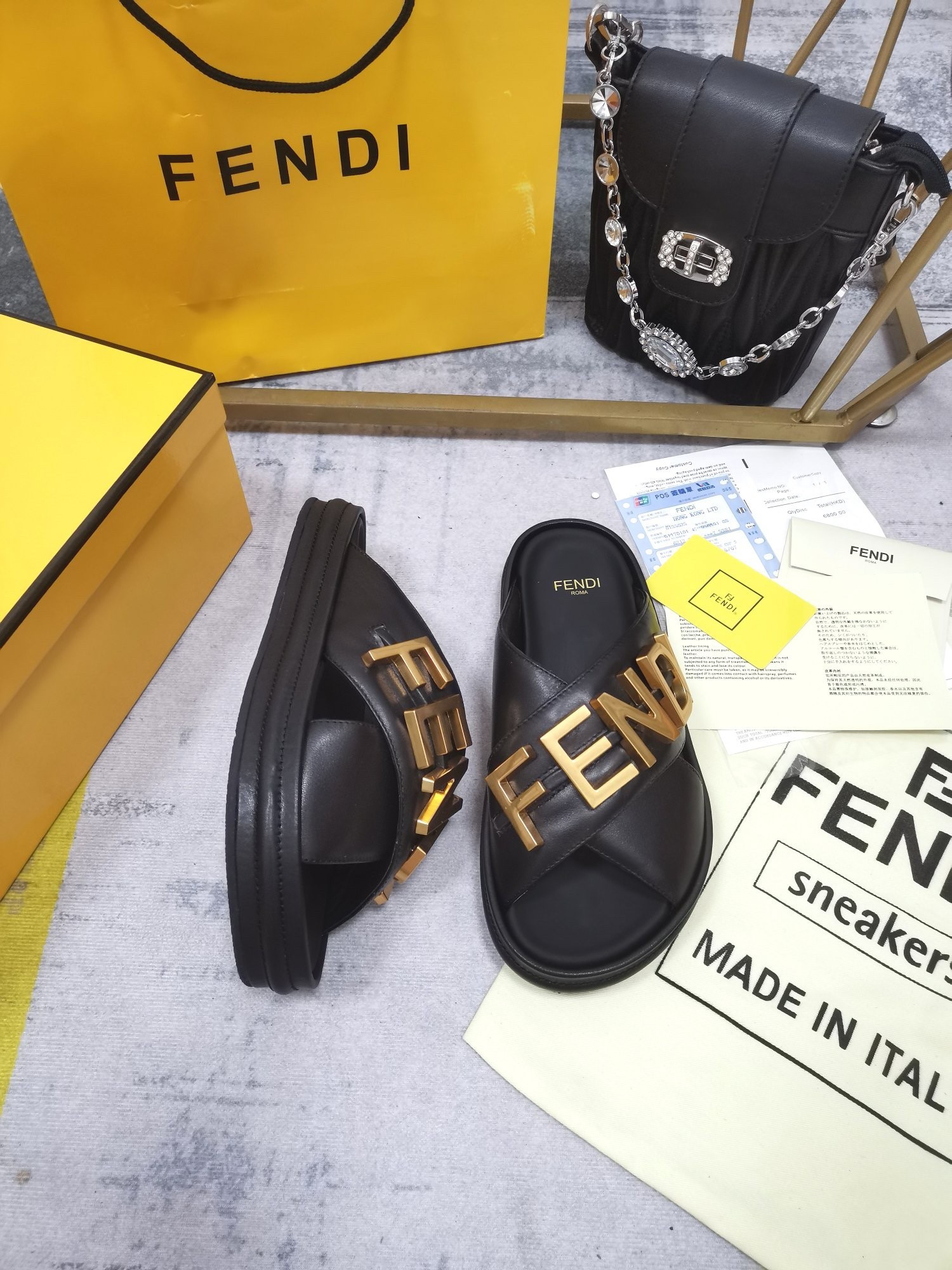 F**di F**digraphy slides in black calfskin