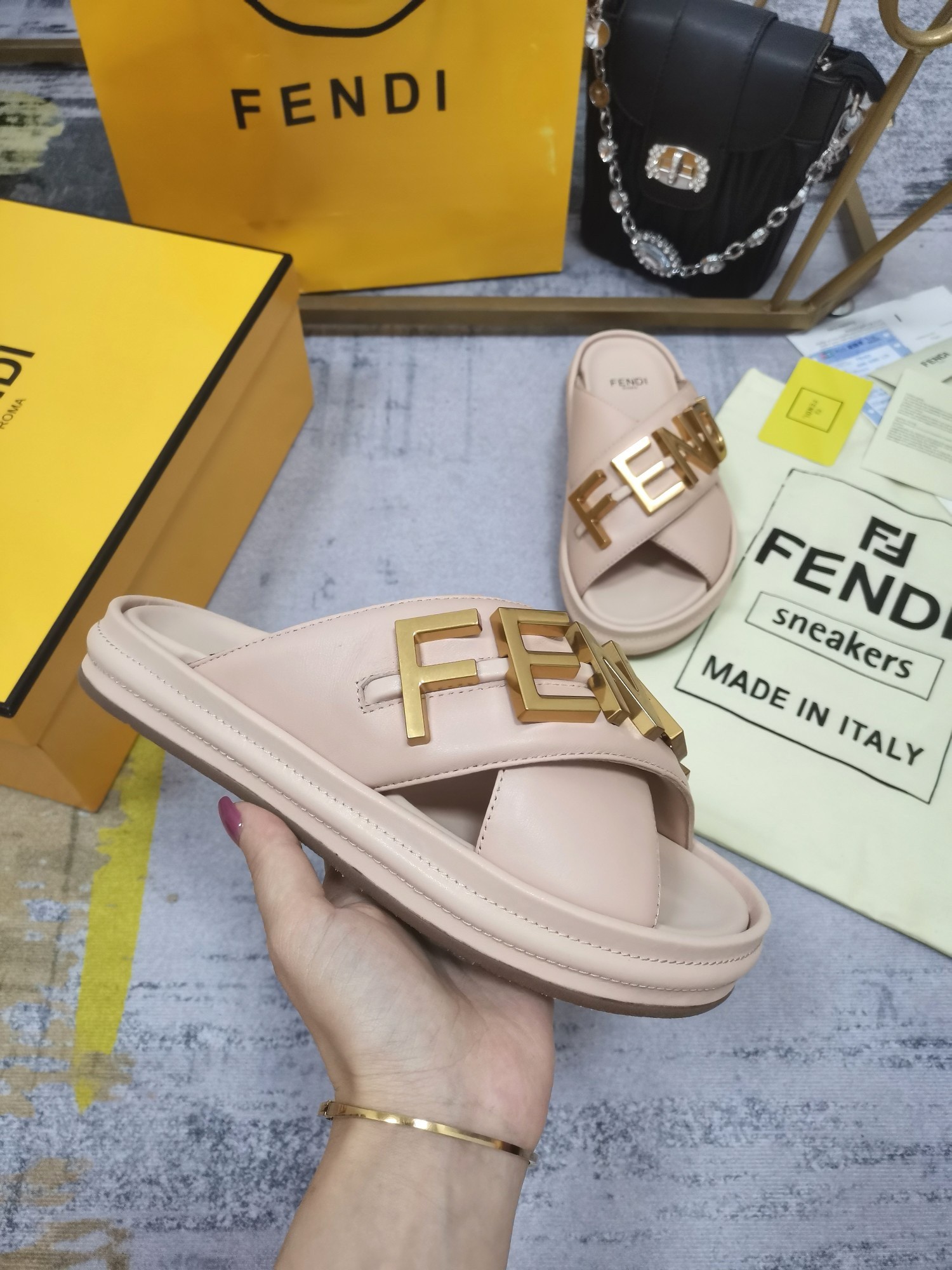 F**di F**digraphy slides in pink calfskin