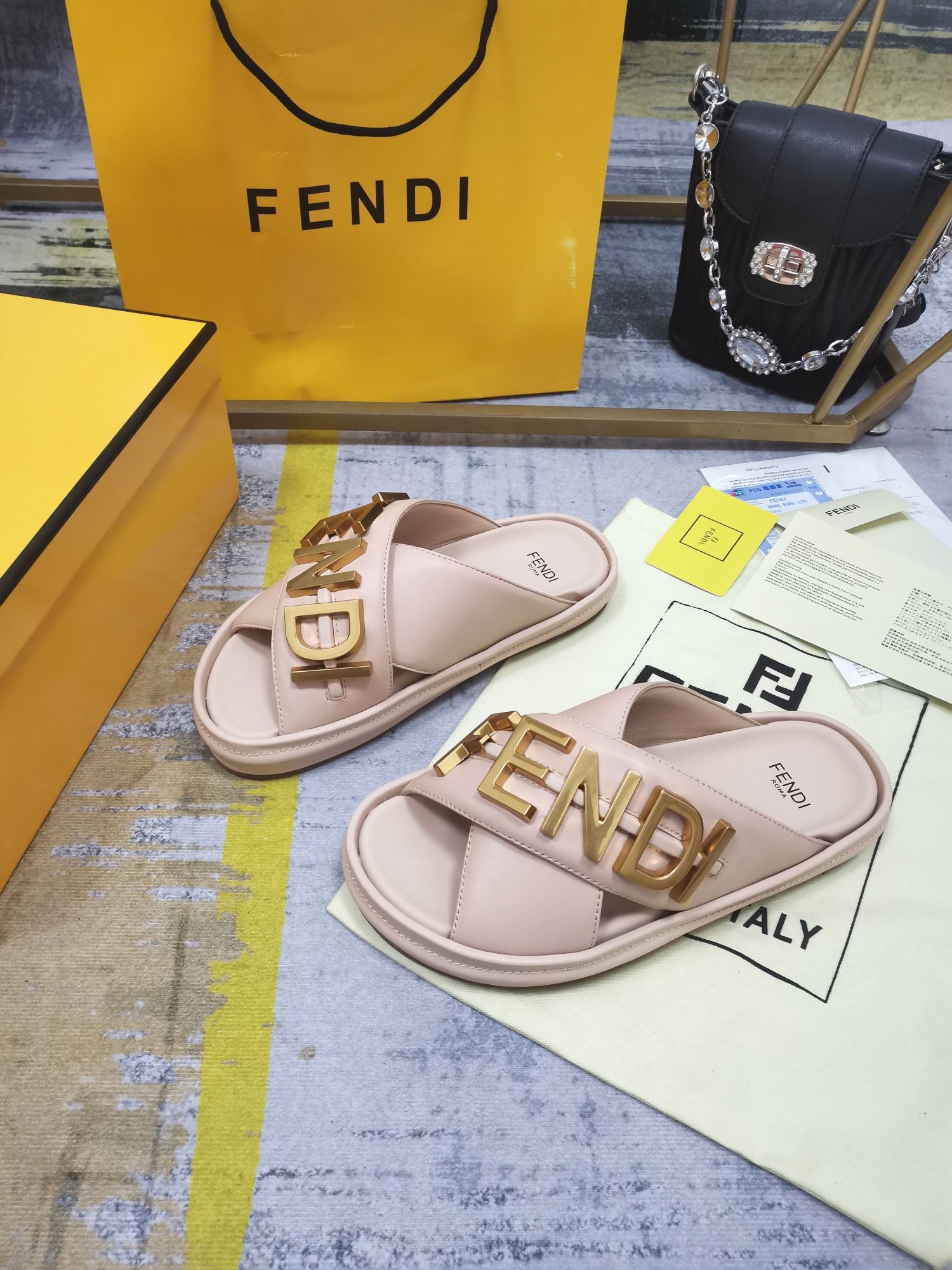 F**di F**digraphy slides in pink calfskin
