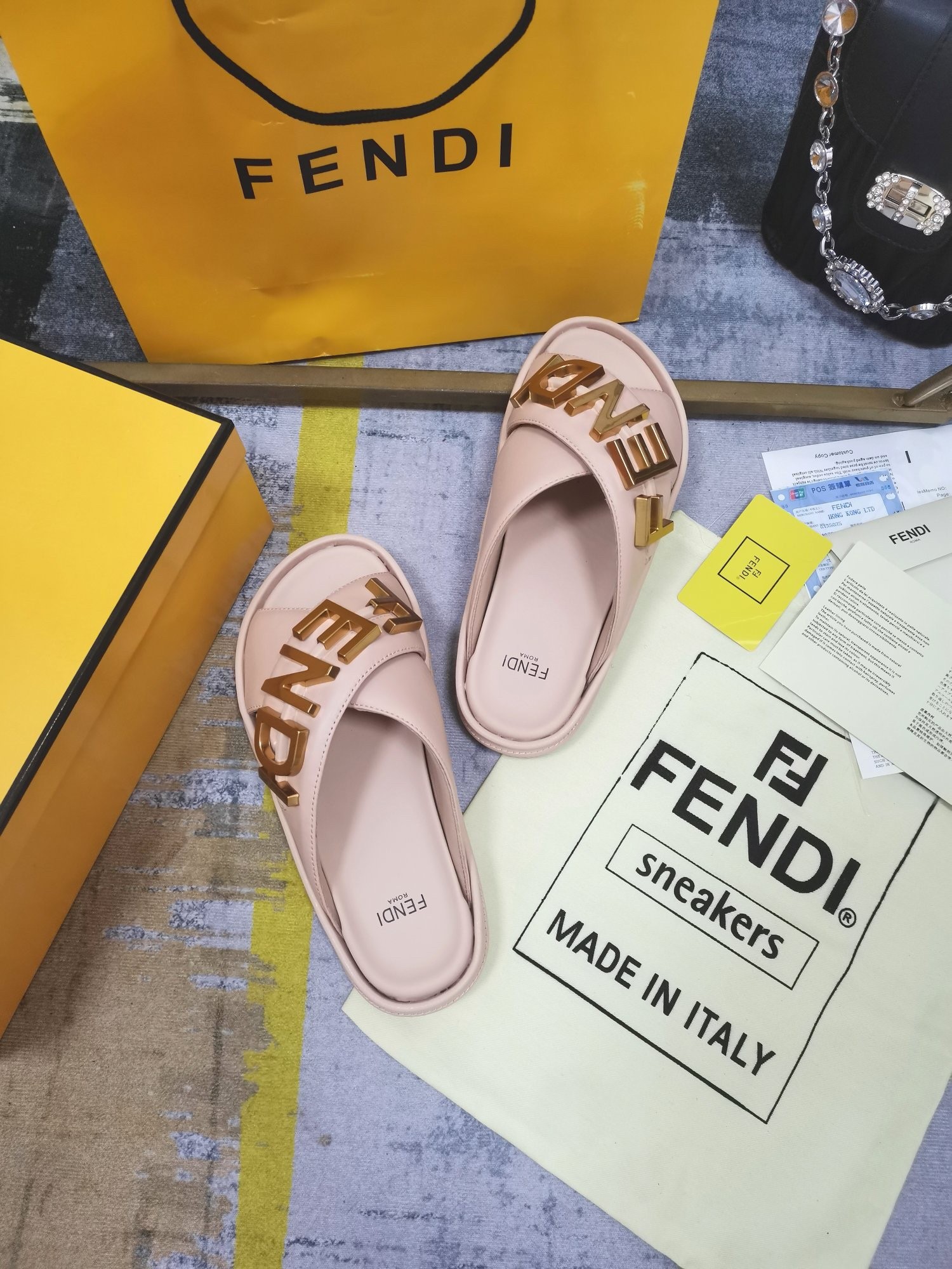 F**di F**digraphy slides in pink calfskin