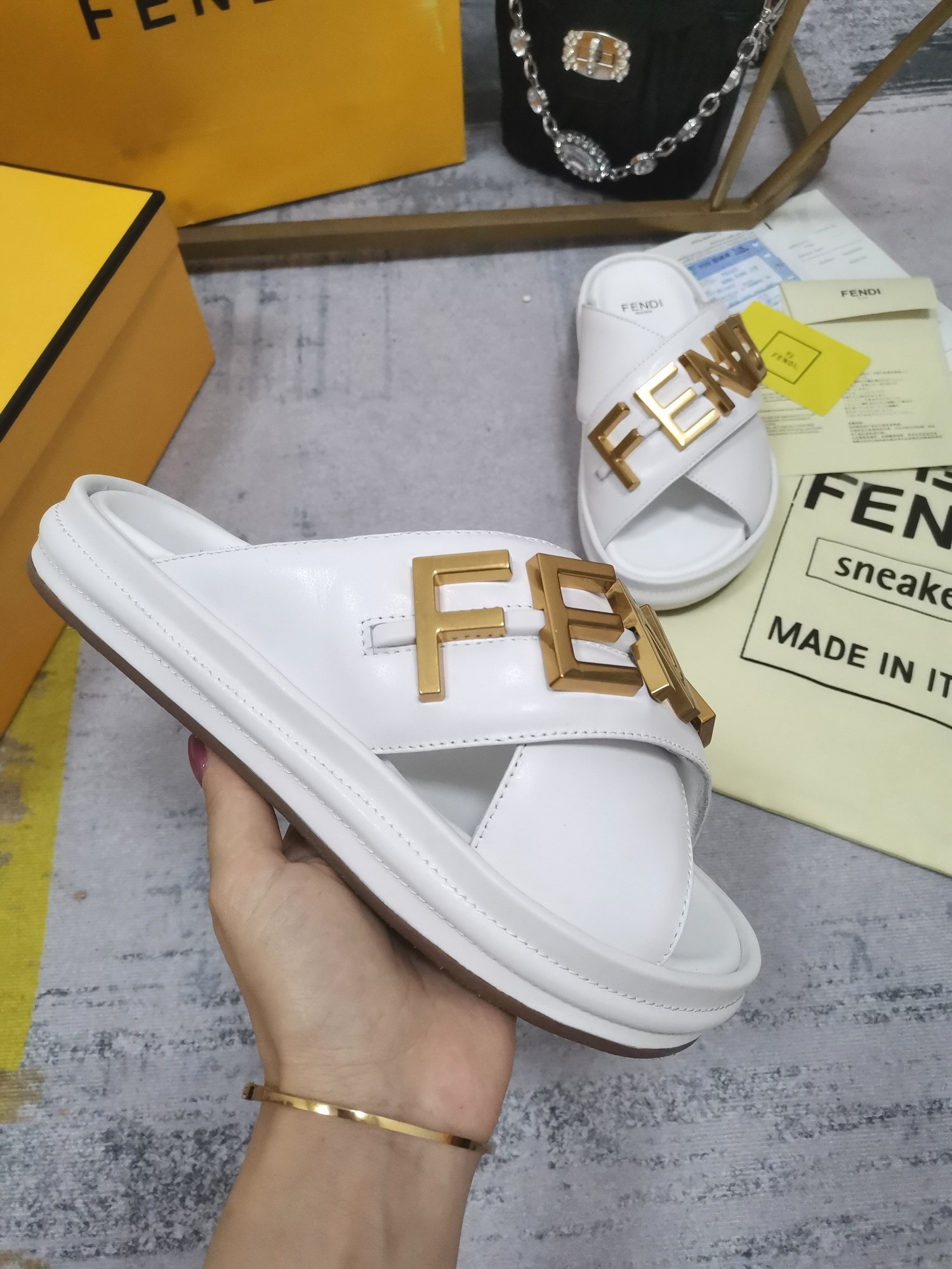 F**di F**digraphy slides in white calfskin