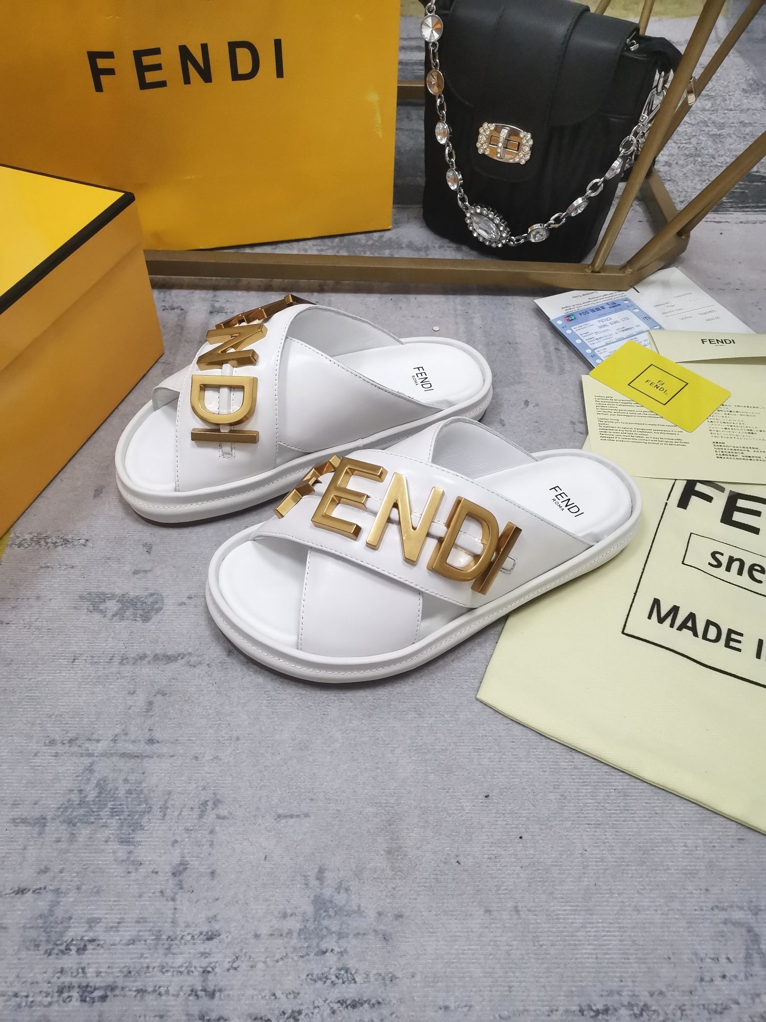 F**di F**digraphy slides in white calfskin