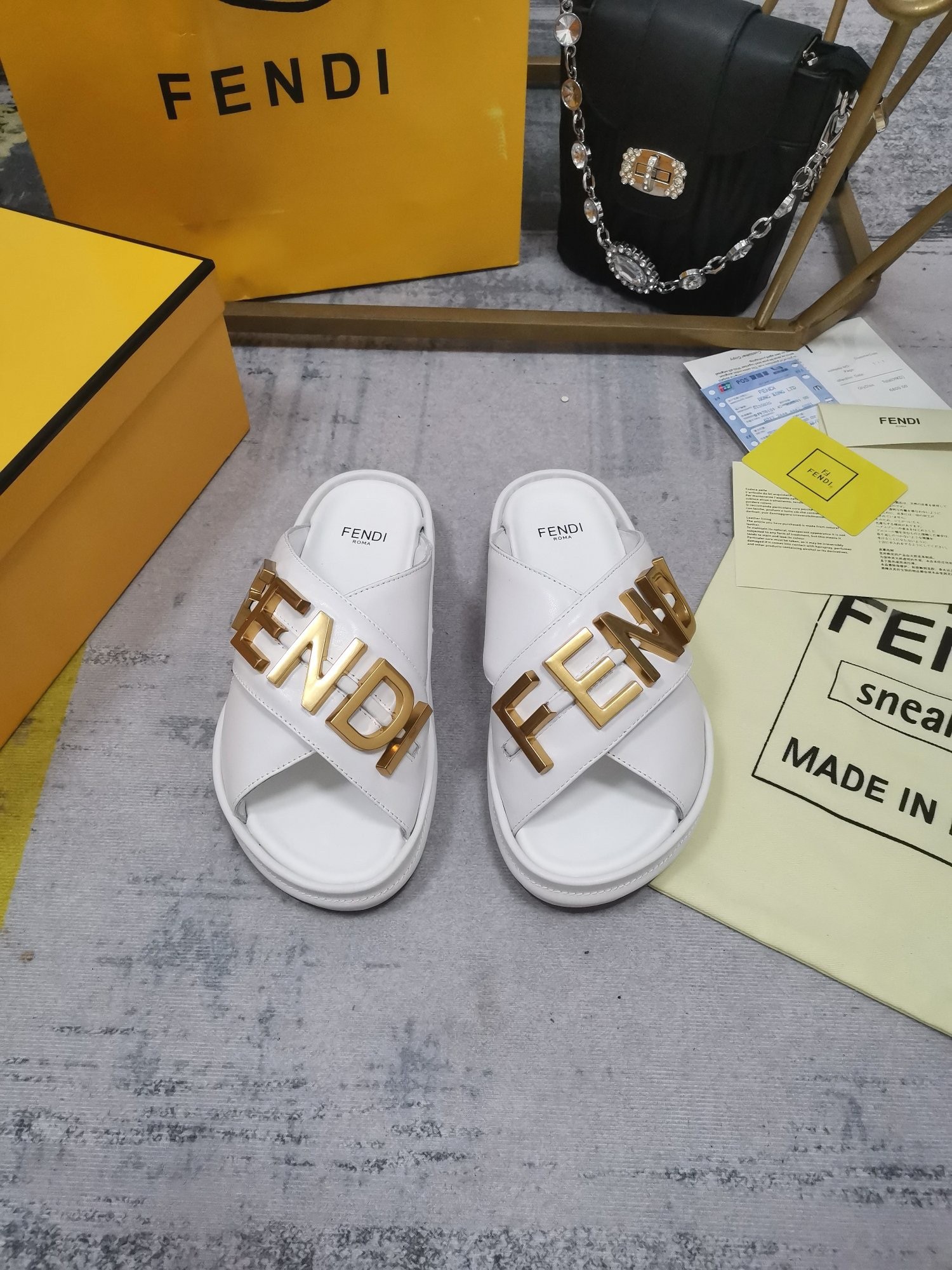 F**di F**digraphy slides in white calfskin