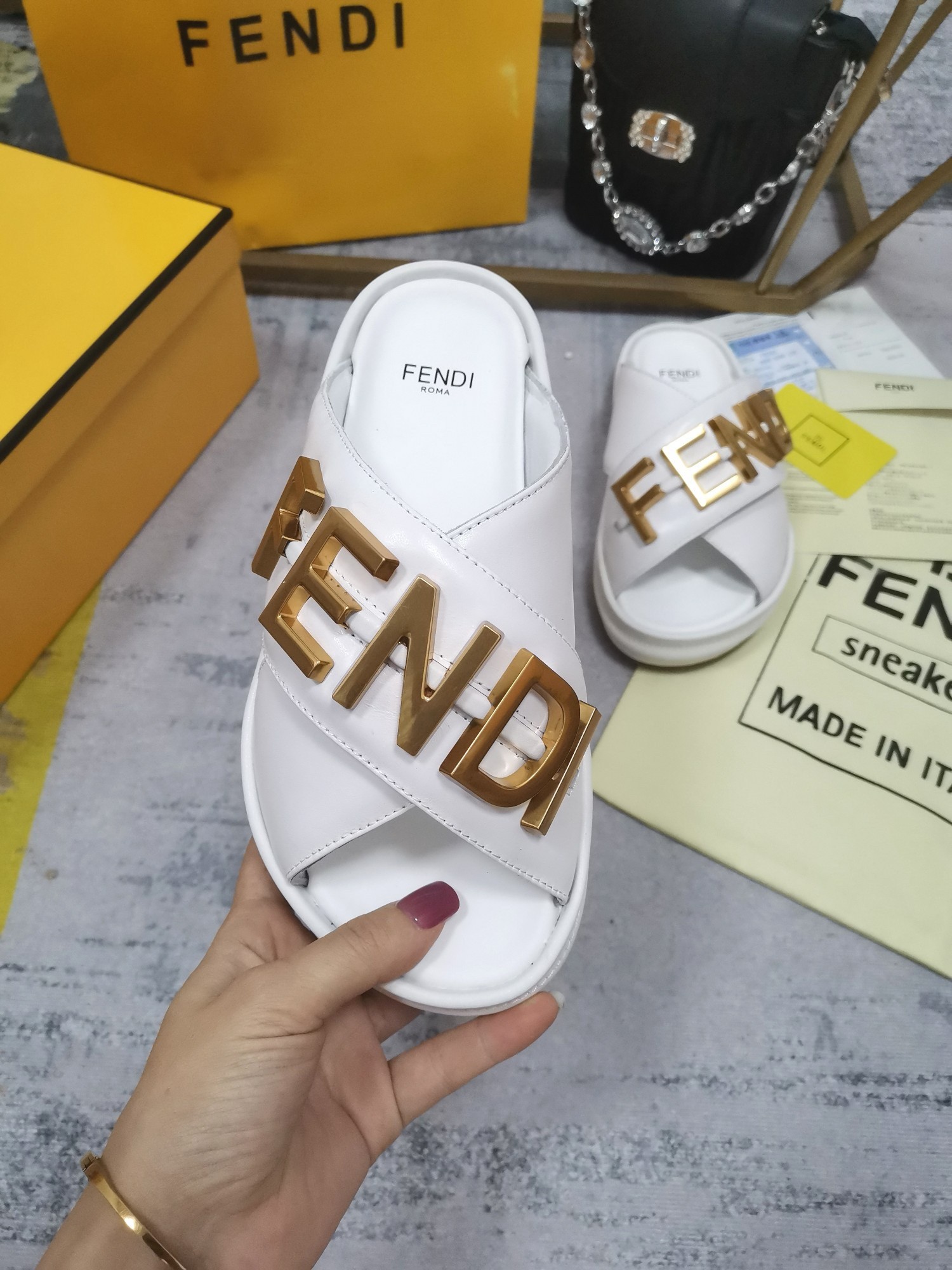 F**di F**digraphy slides in white calfskin